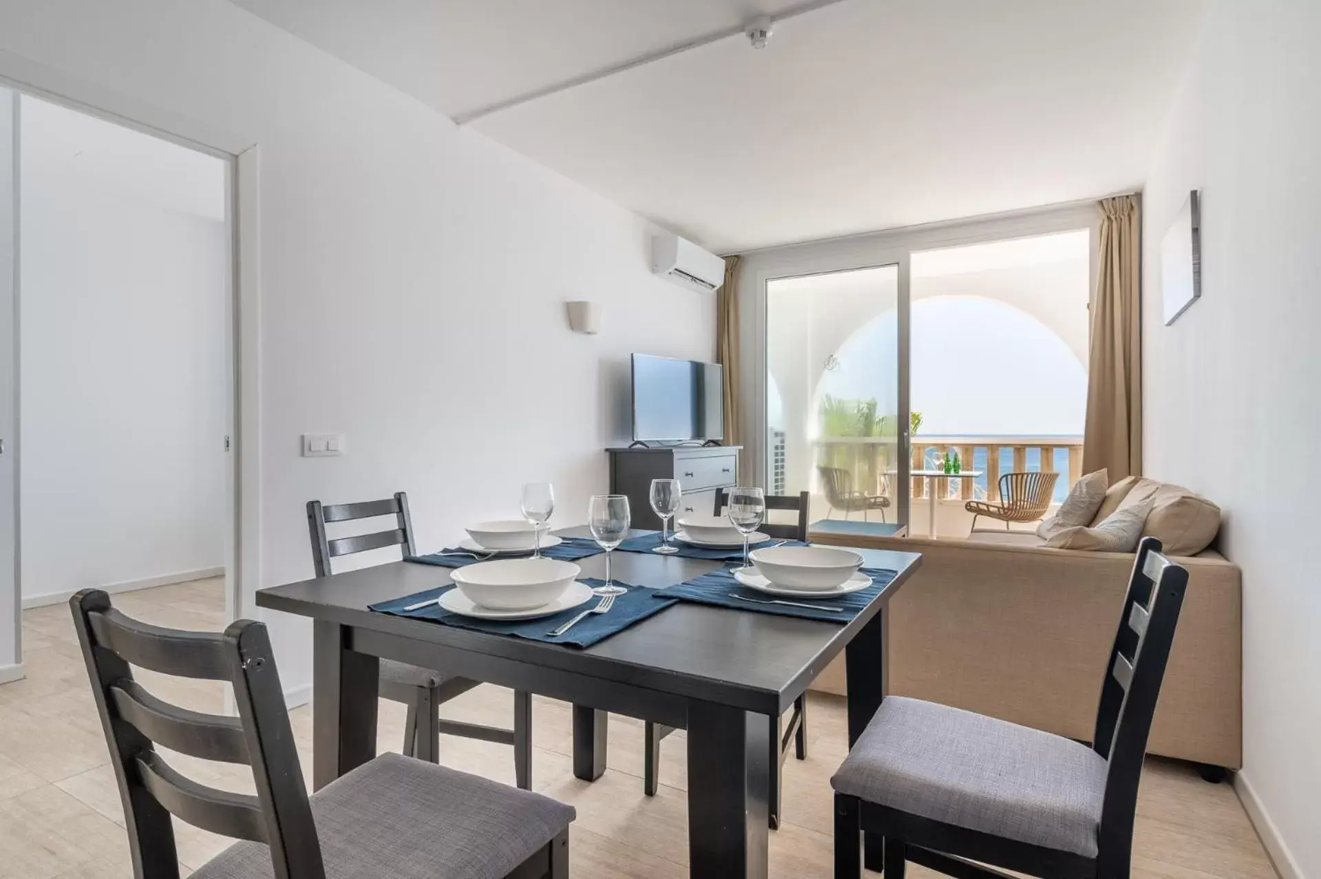 Living room, Dining Area in Orange Colom - Seaside Apartments