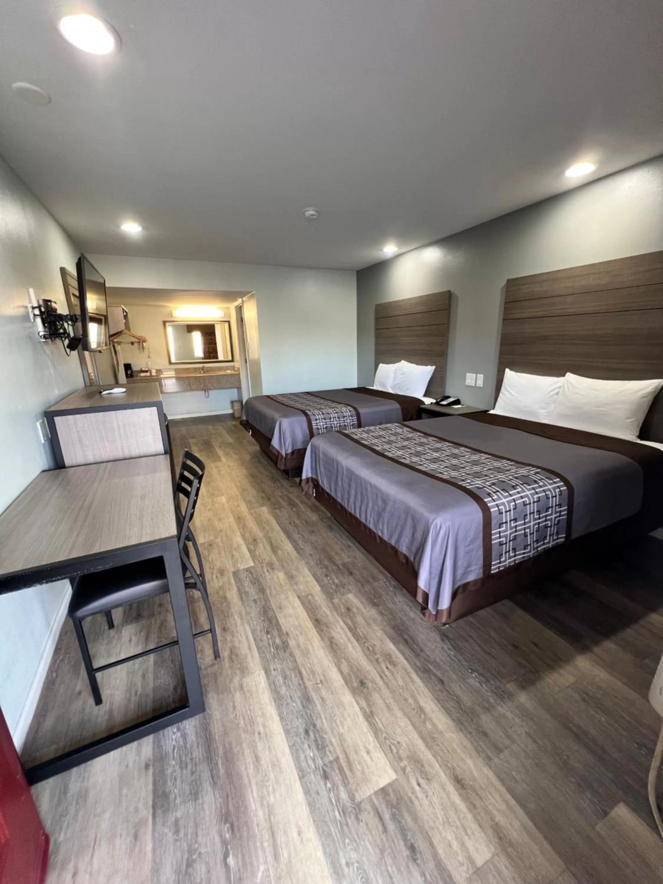 Bed in Continental Inn and Suites Nacogdoches TX SFA University Downtown