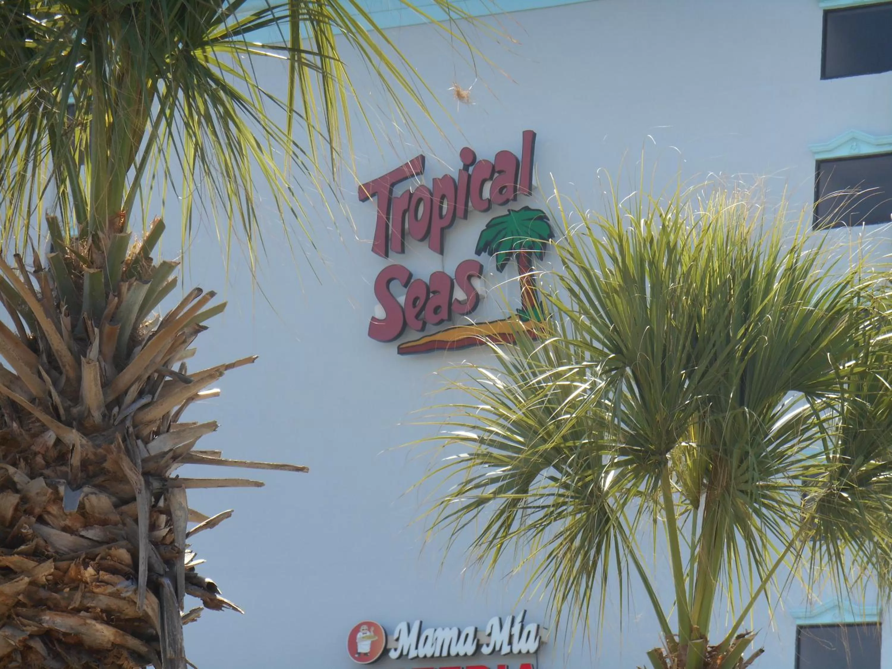 Property logo or sign in Tropical Seas Hotel
