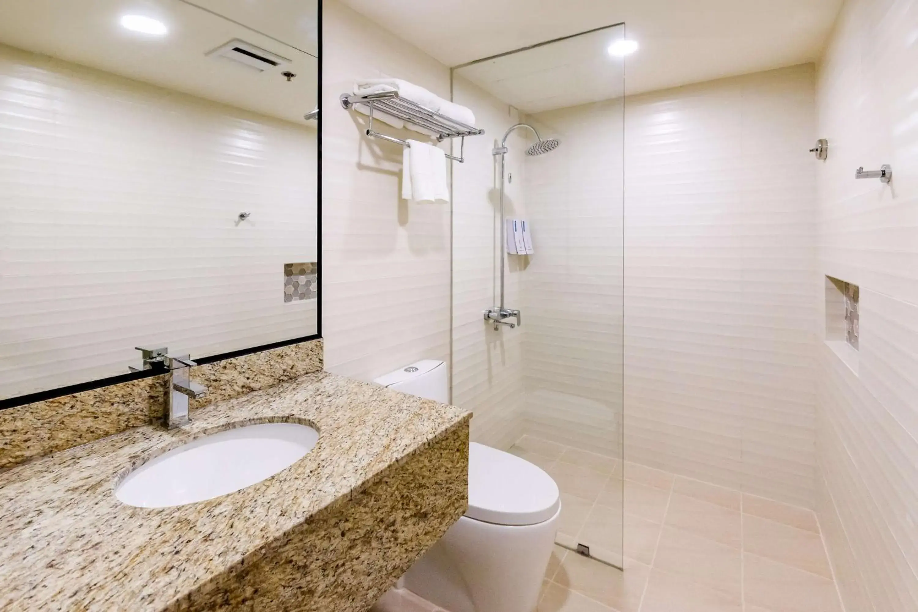 Bathroom in SureStay Plus by Best Western Cebu City