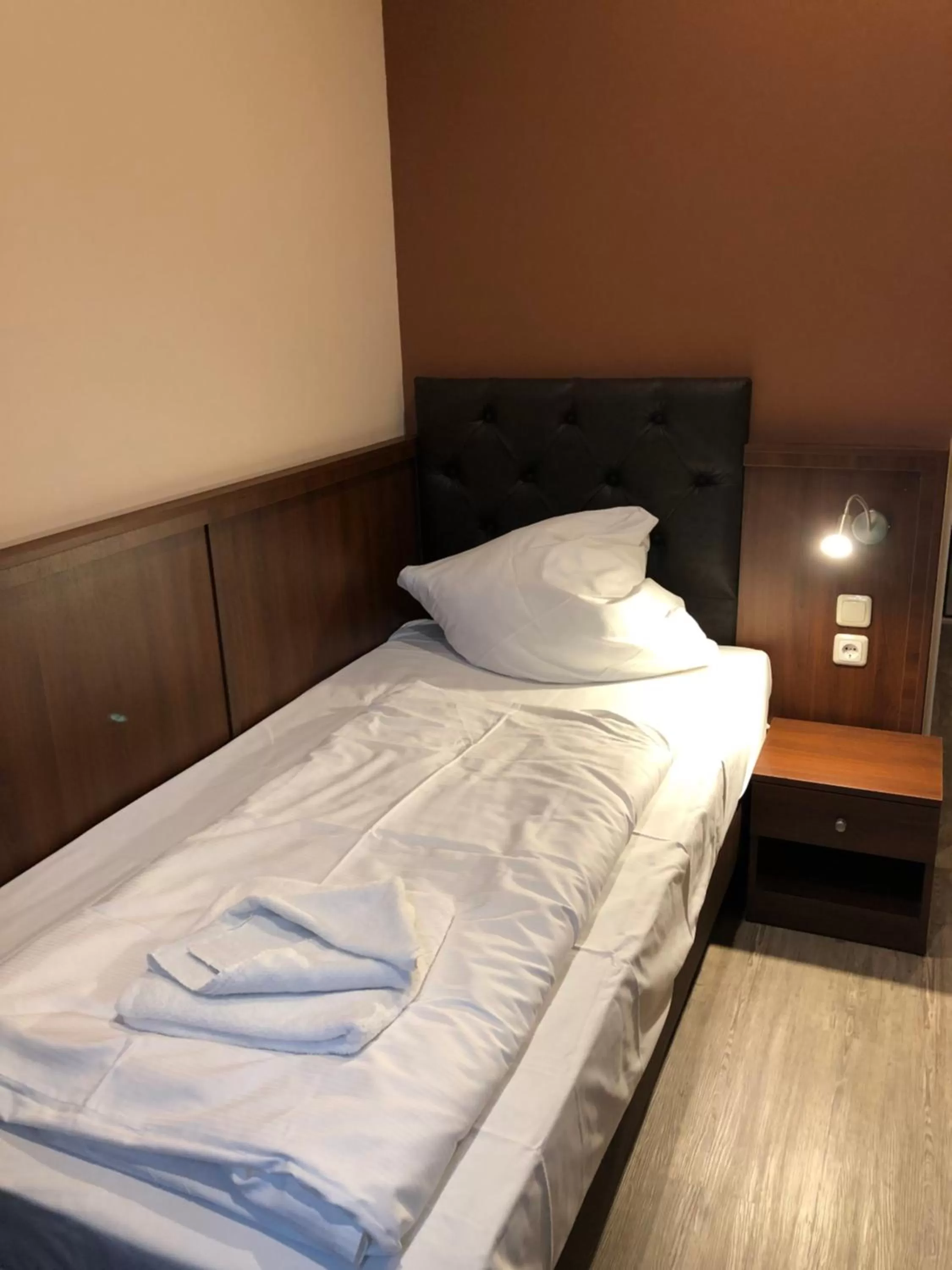 Bed in Hotel Poseidon