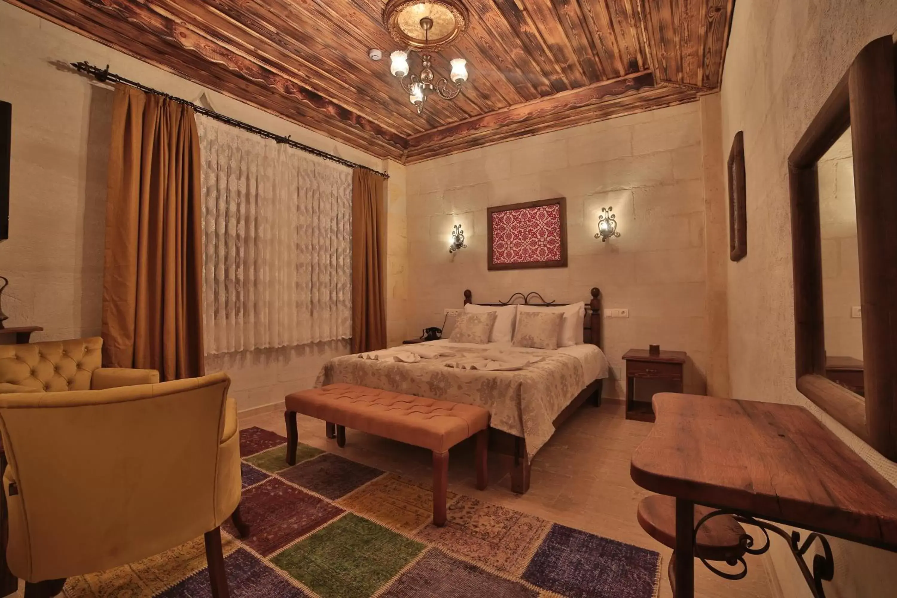 Bed in Caravanserai Inn Hotel