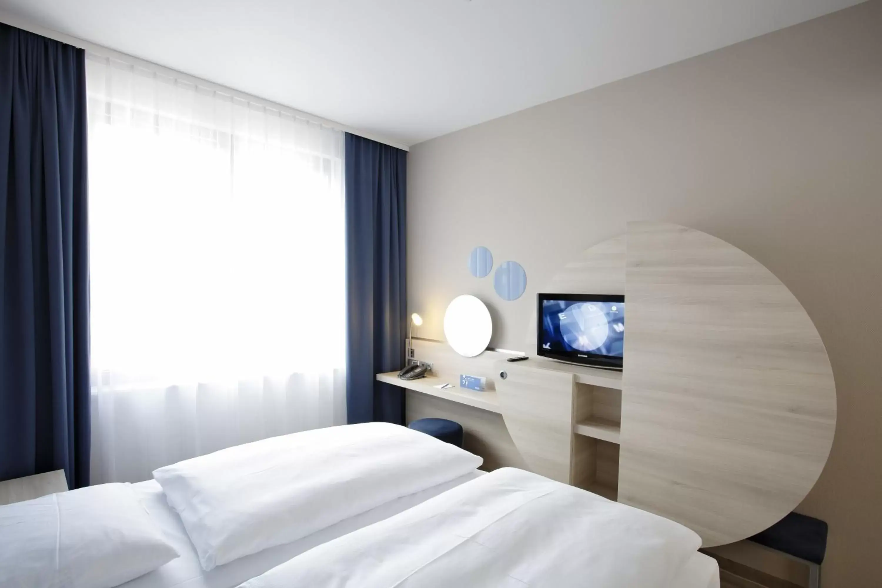 Bed in H2 Hotel Berlin-Alexanderplatz