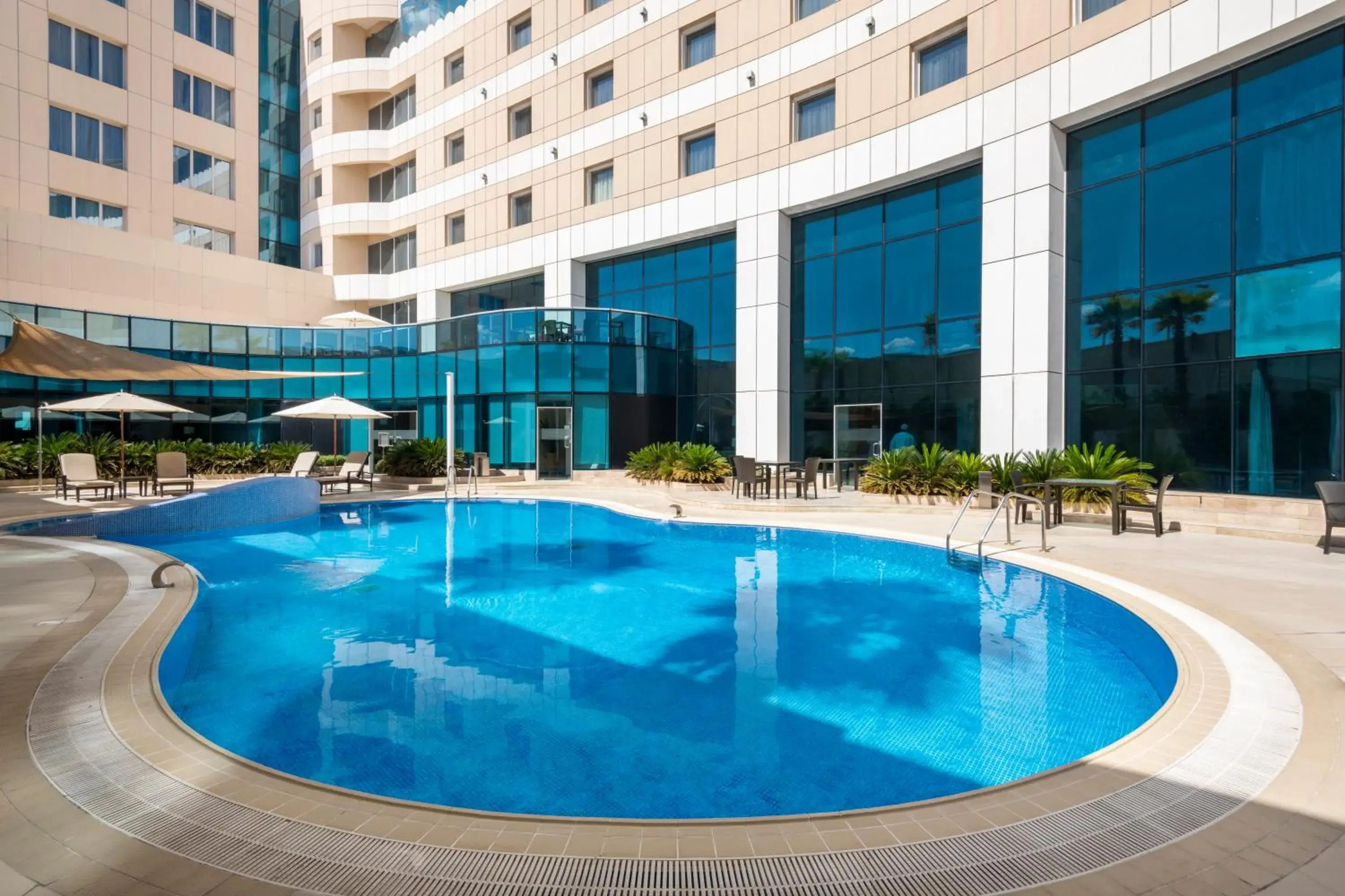 Swimming pool in Holiday Inn Muscat AlSeeb by IHG Swimming pool in Holiday Inn Muscat AlSeeb by IHG