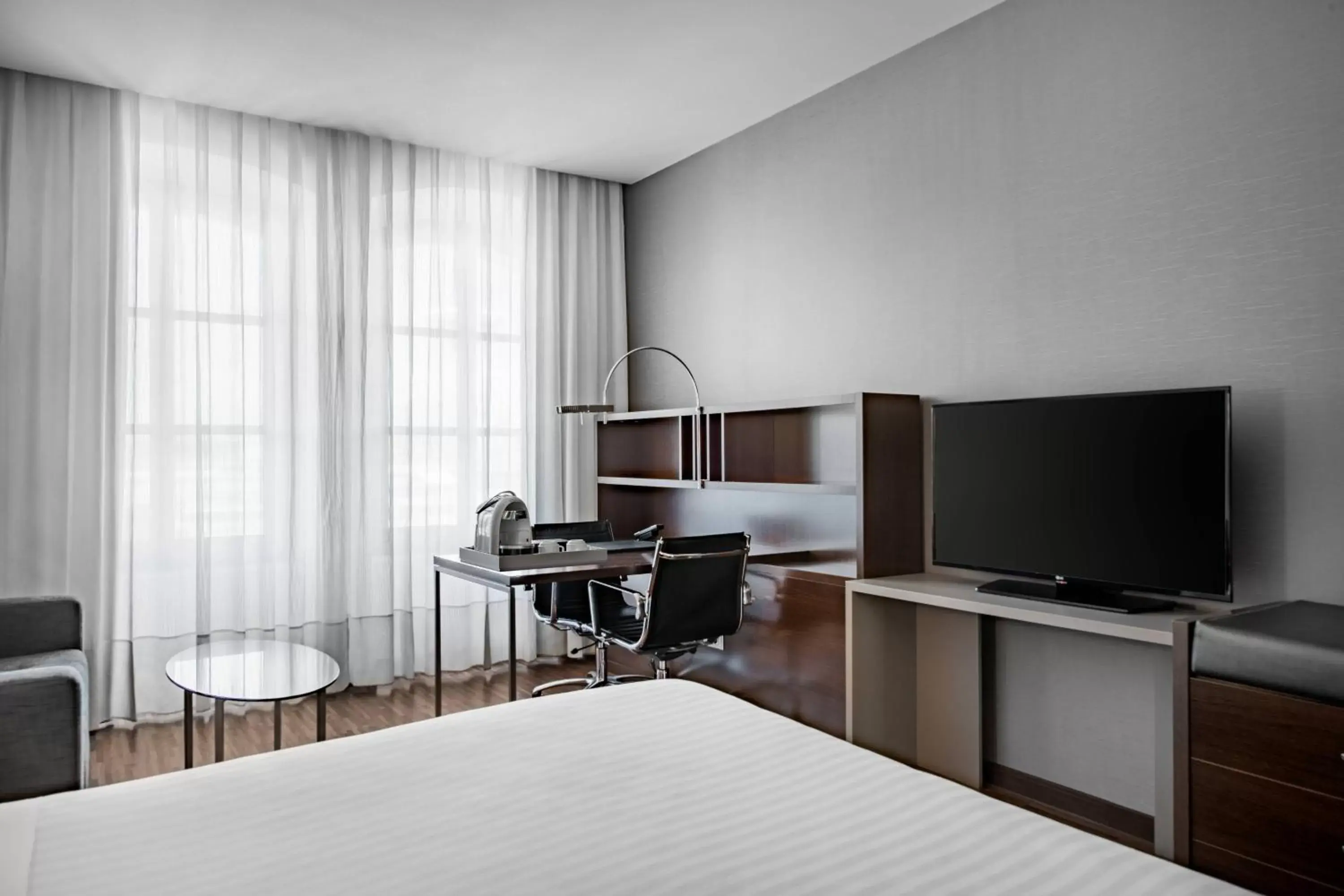Photo of the whole room, TV/Entertainment Center in AC Hotel Torino by Marriott