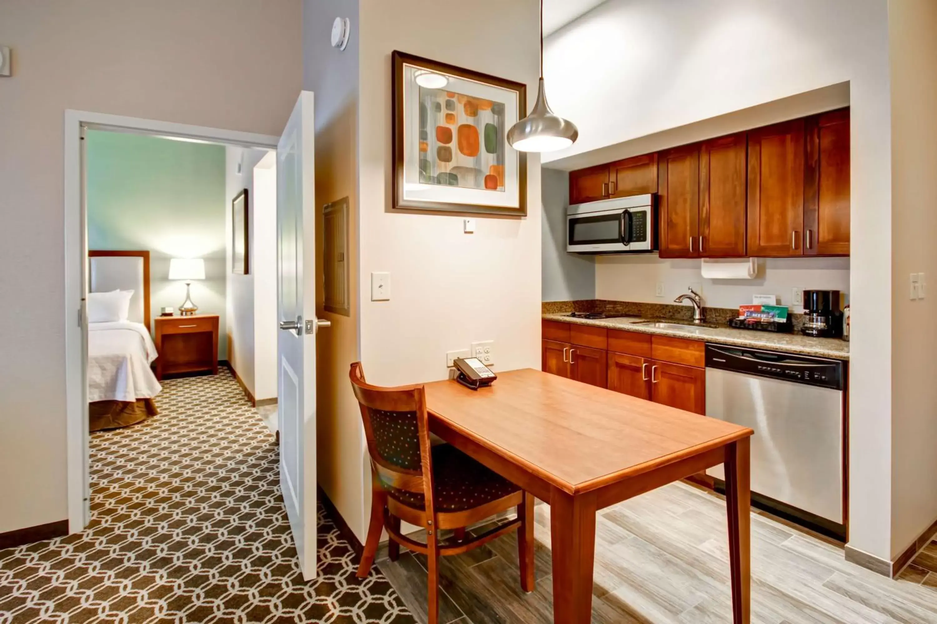 Bed, Kitchen/Kitchenette in Homewood Suites by Hilton Greeley