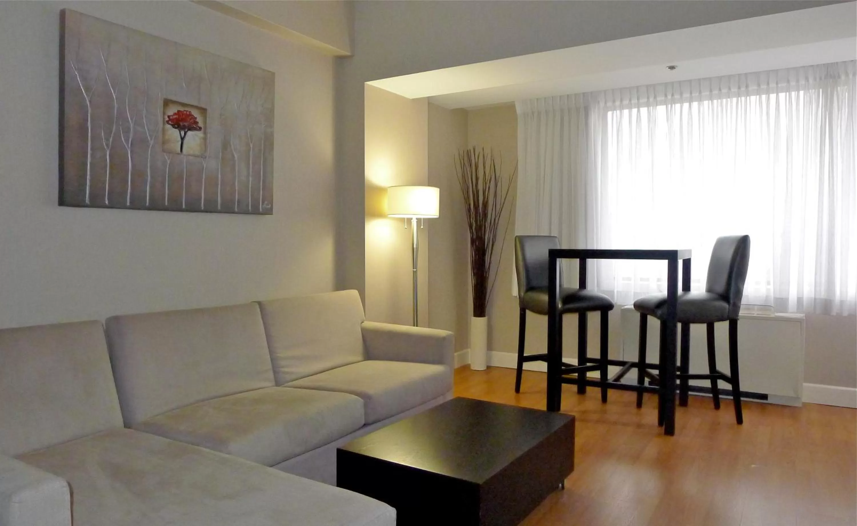 Living room in Armon Plaza Montreal Airpt, Trademark Collection by Wyndham