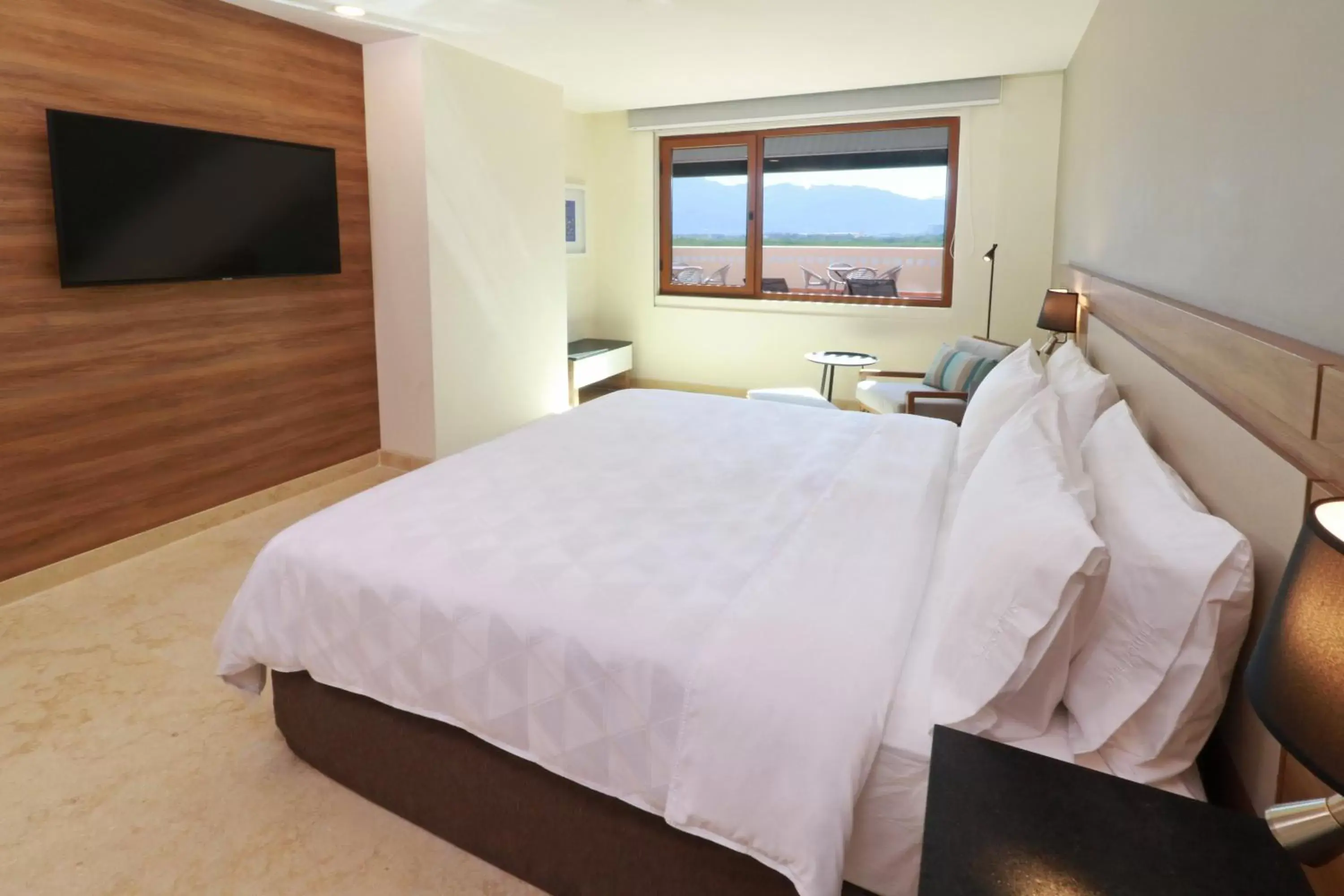 Photo of the whole room, Bed in Holiday Inn & Suites - Puerto Vallarta Marina & Golf, an IHG Hotel