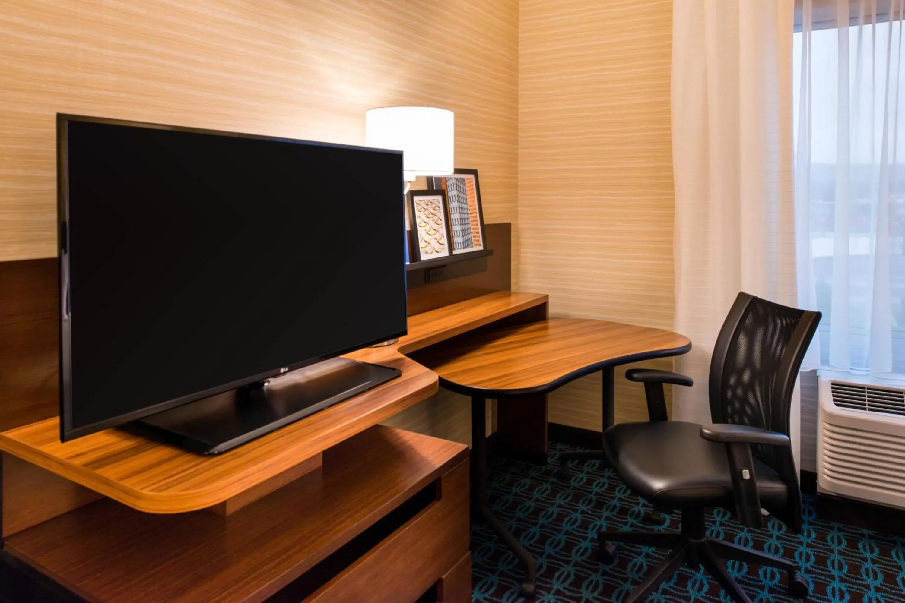 Photo of the whole room, TV/Entertainment Center in Fairfield Inn & Suites by Marriott Utica