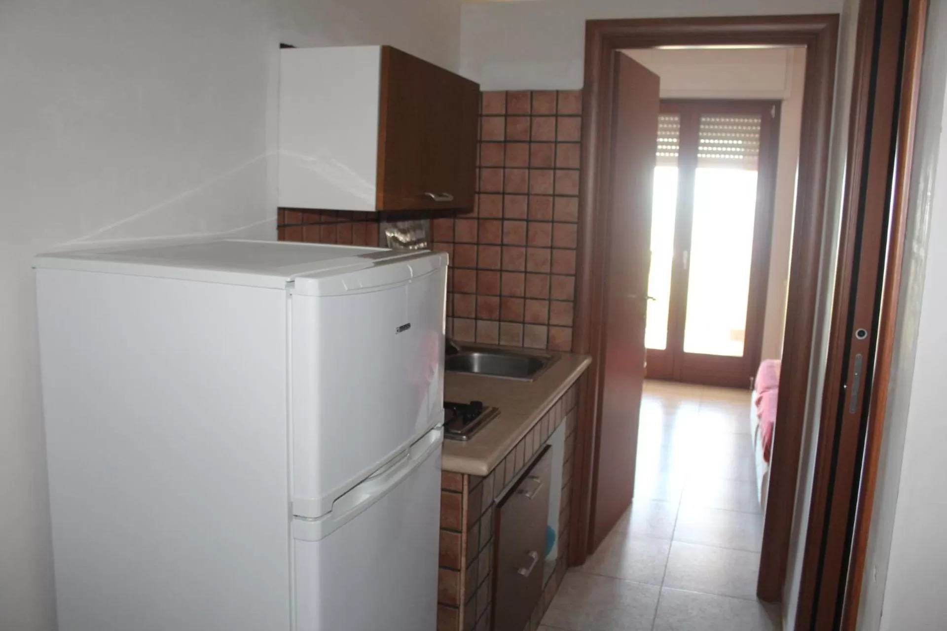 Patio, Kitchen/Kitchenette in Residence Hotel Torresilvana