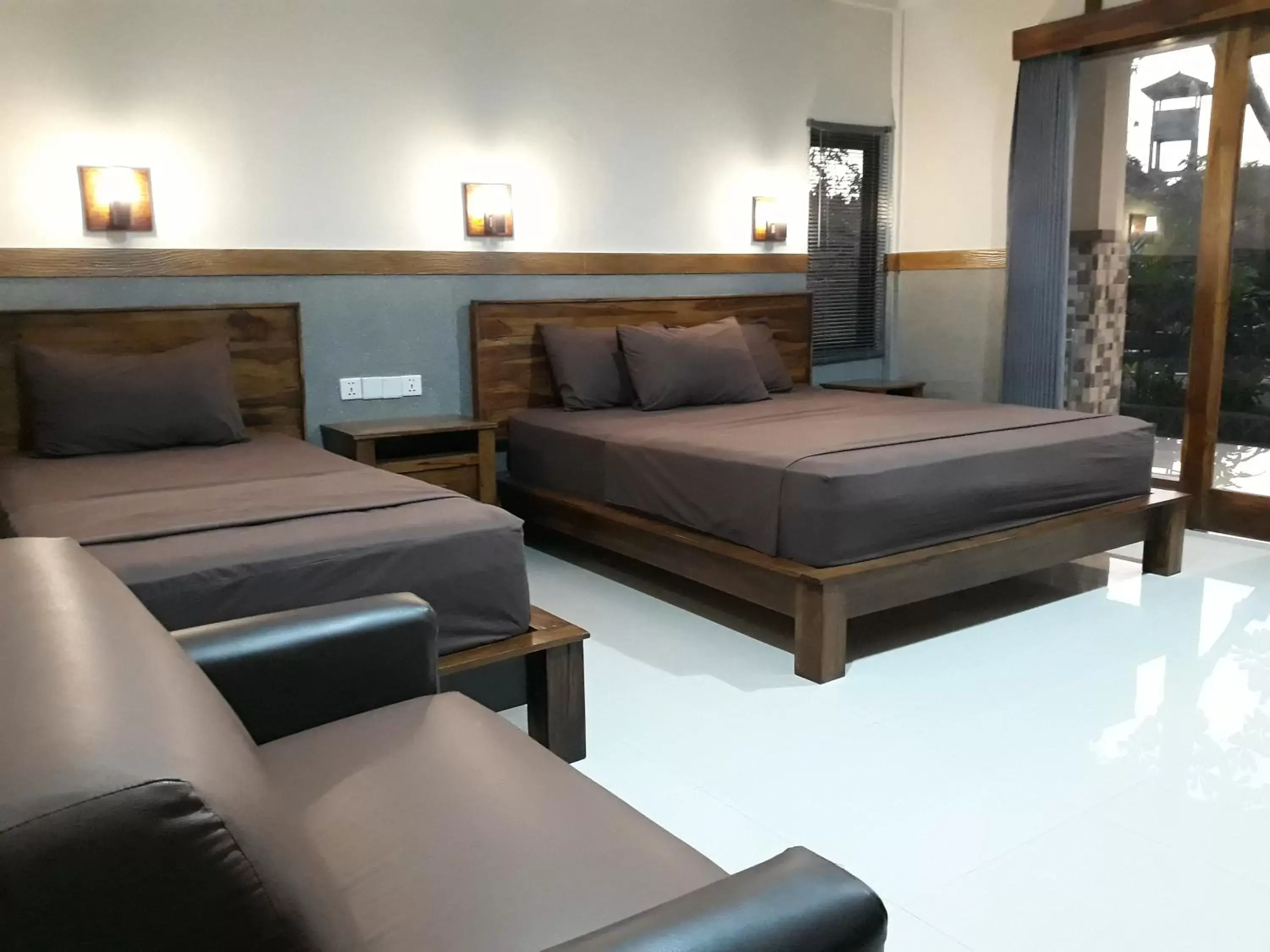 Deluxe Triple Room in Puri Bali Hotel Deluxe Triple Room in Puri Bali Hotel