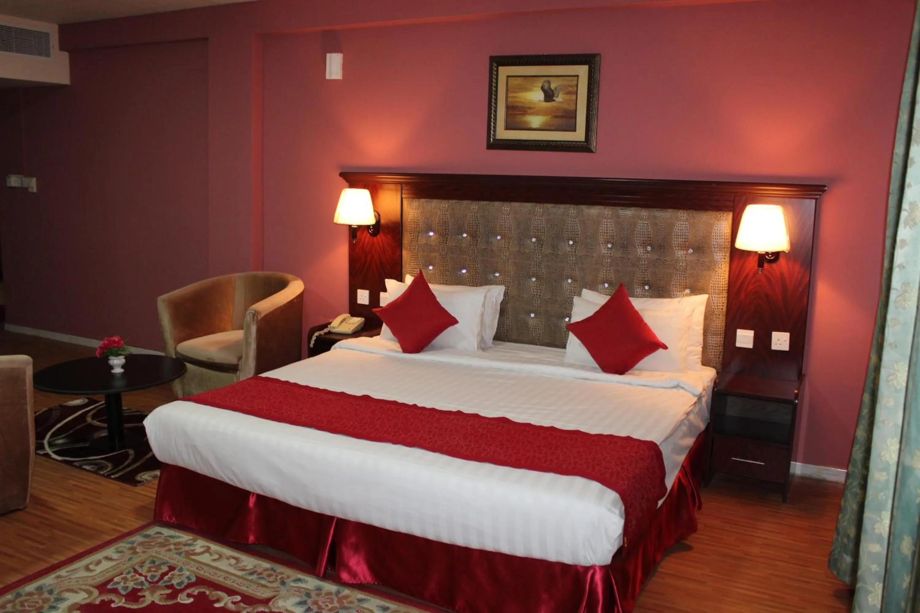 Bed in Grand Nova Hotel