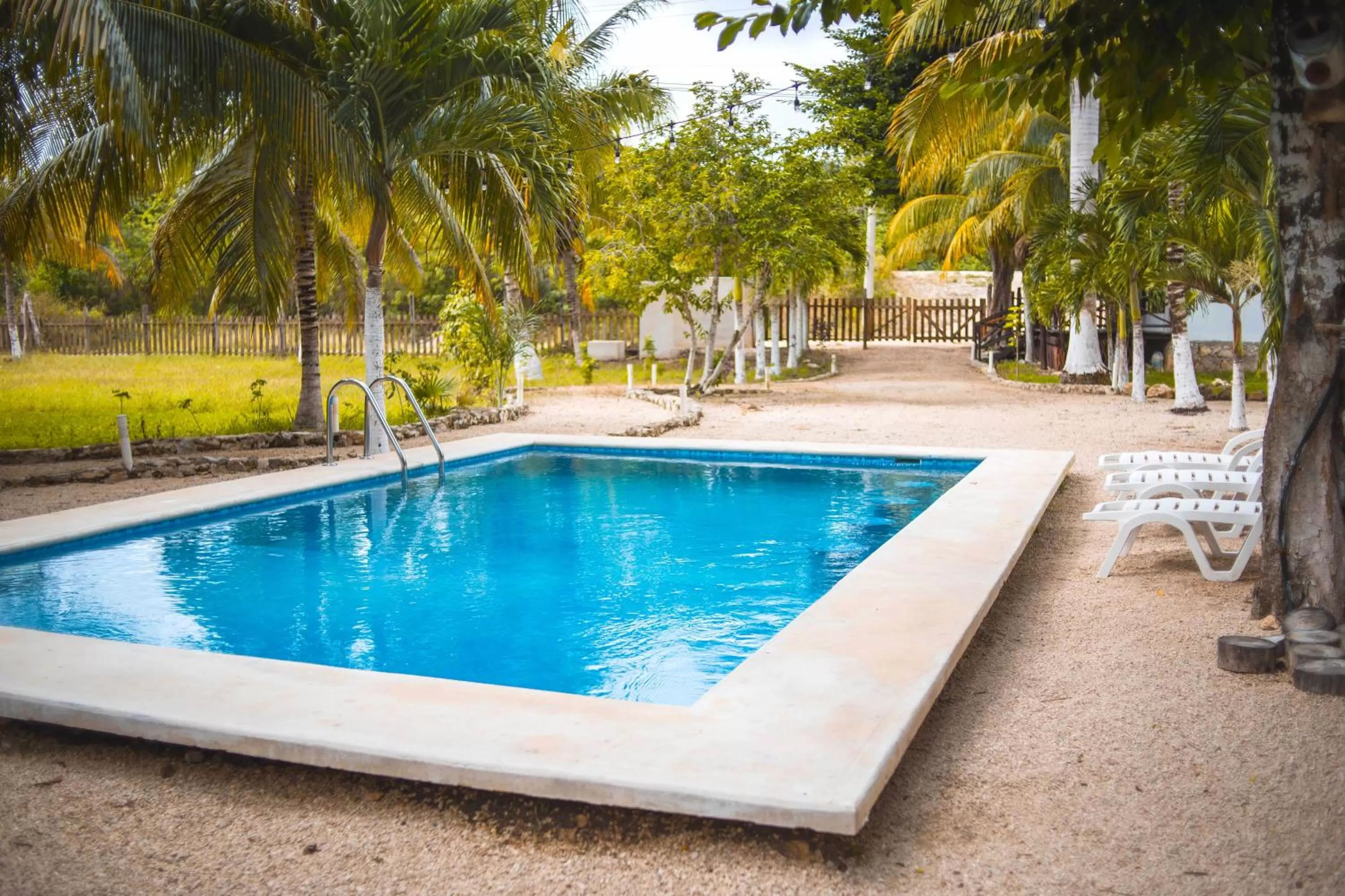 Swimming pool in Royal Palm Bacalar Cabañas & Lagoon Club