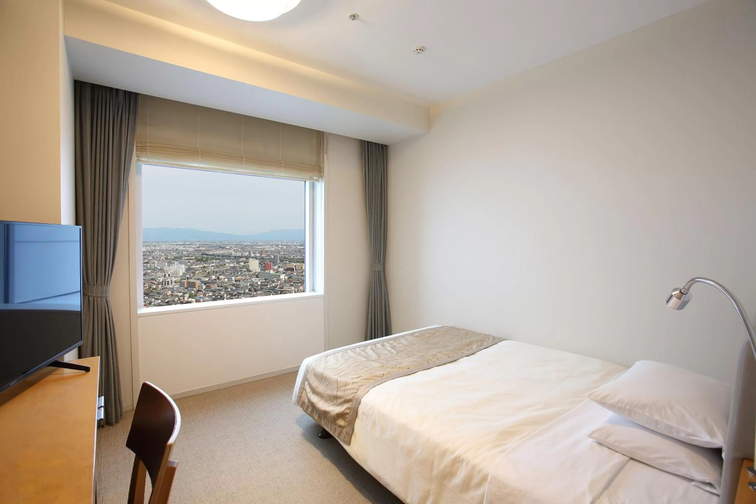 Bed in Hotel Nikko Niigata