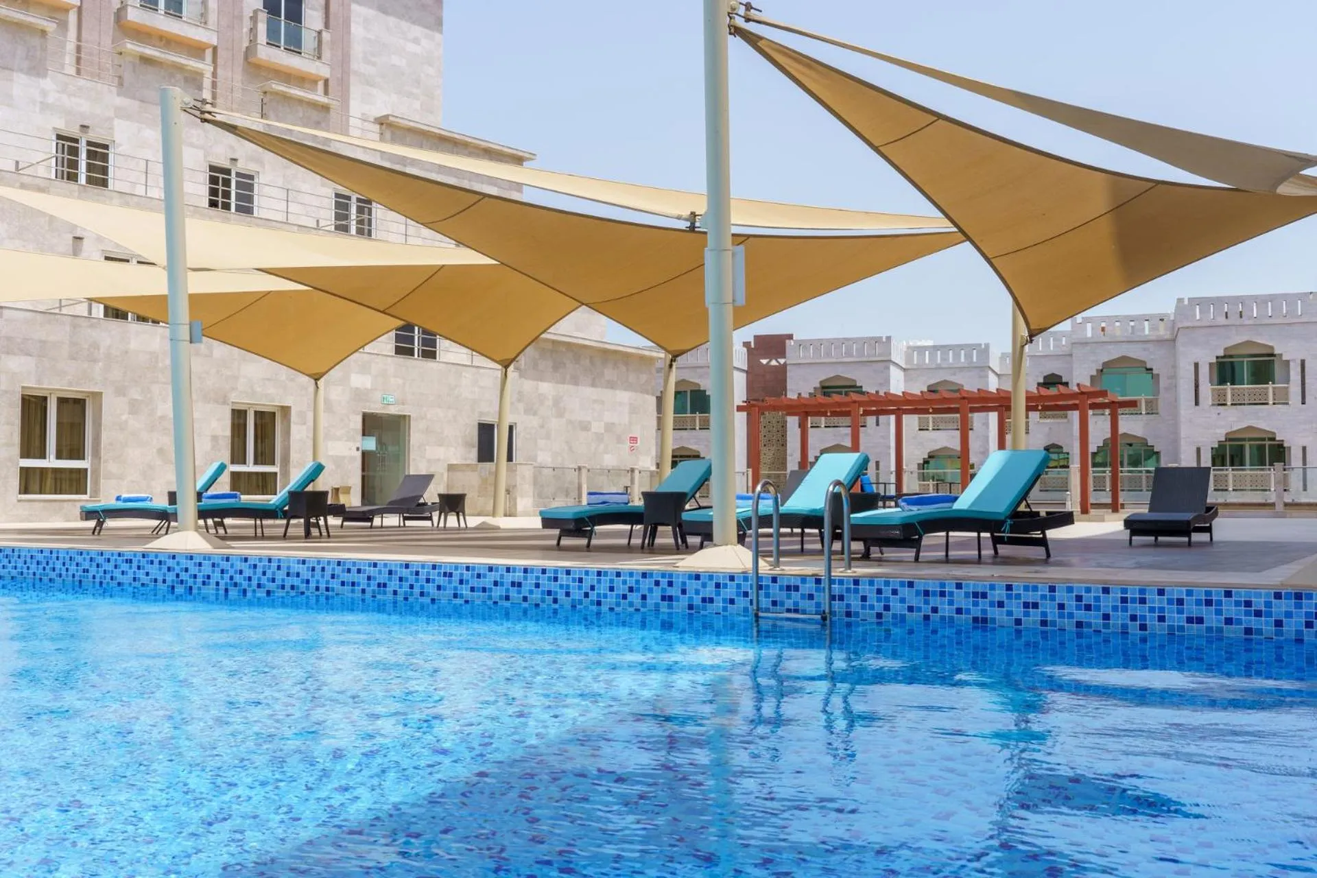 Swimming pool in Levatio Suites Muscat, a member of Radisson Individuals