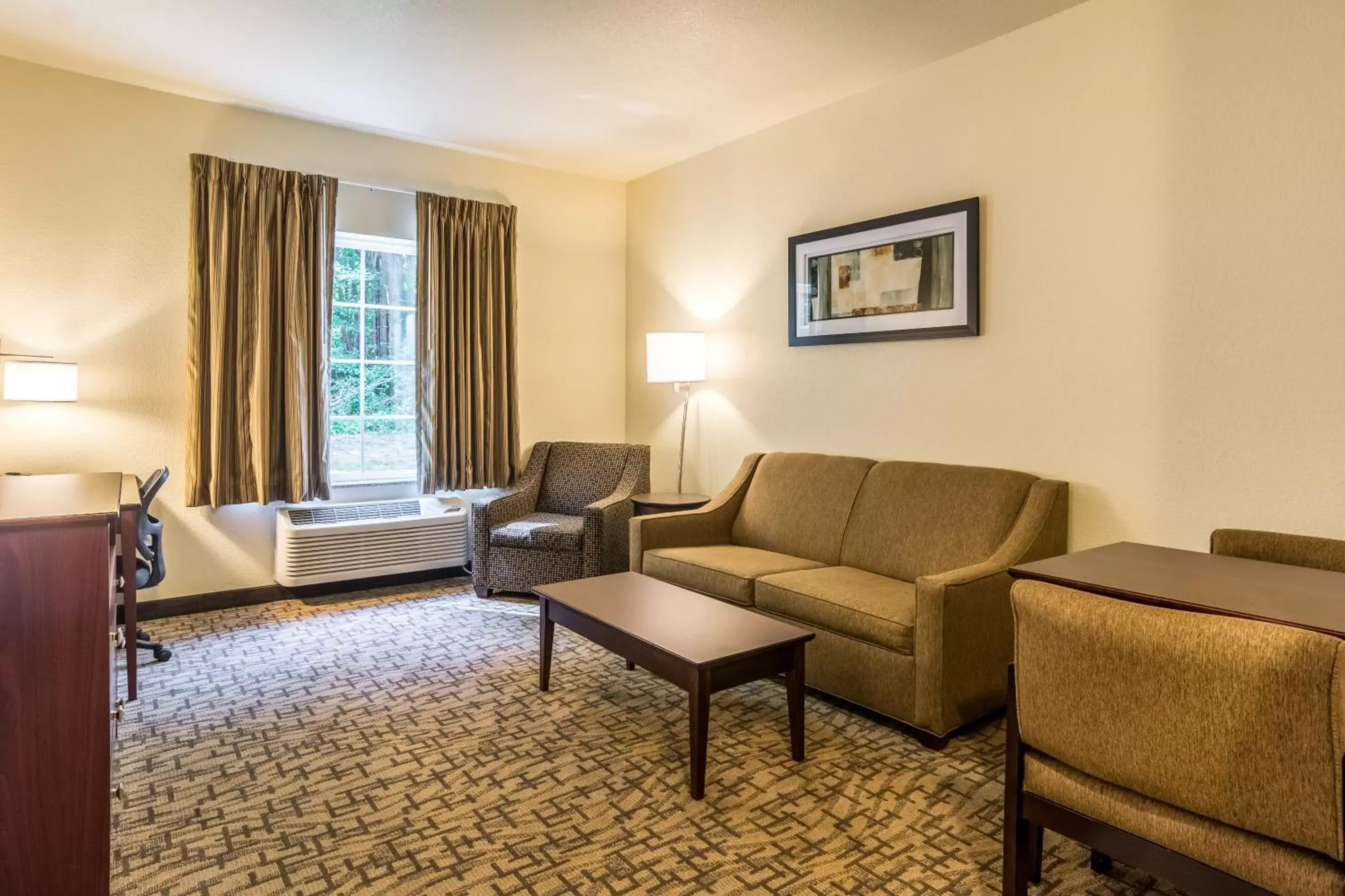 Bed, Seating Area in Cobblestone Hotel & Suites - Torrington