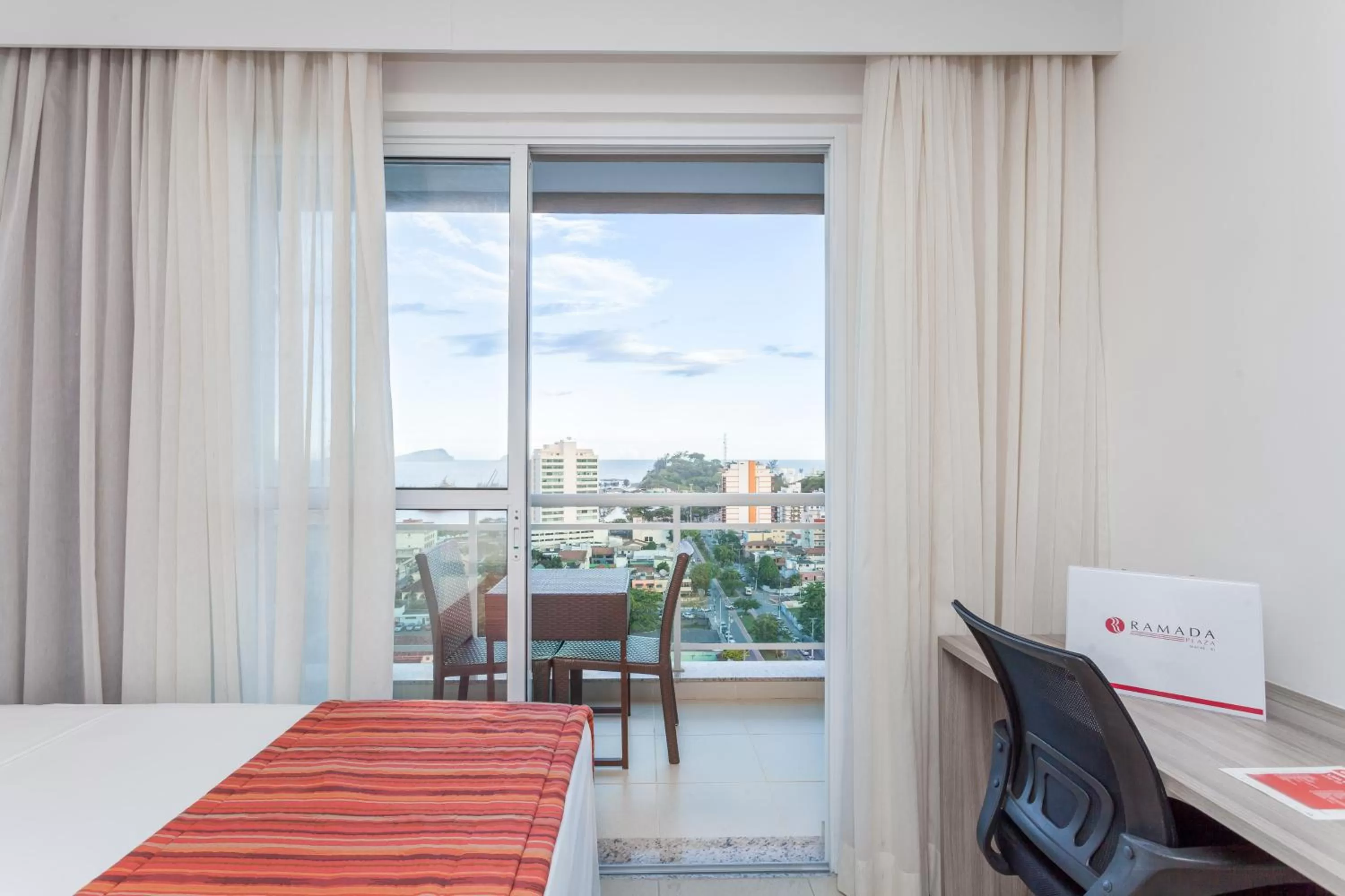Balcony/Terrace, Bed in Ramada by Wyndham Macae Hotel & Suites