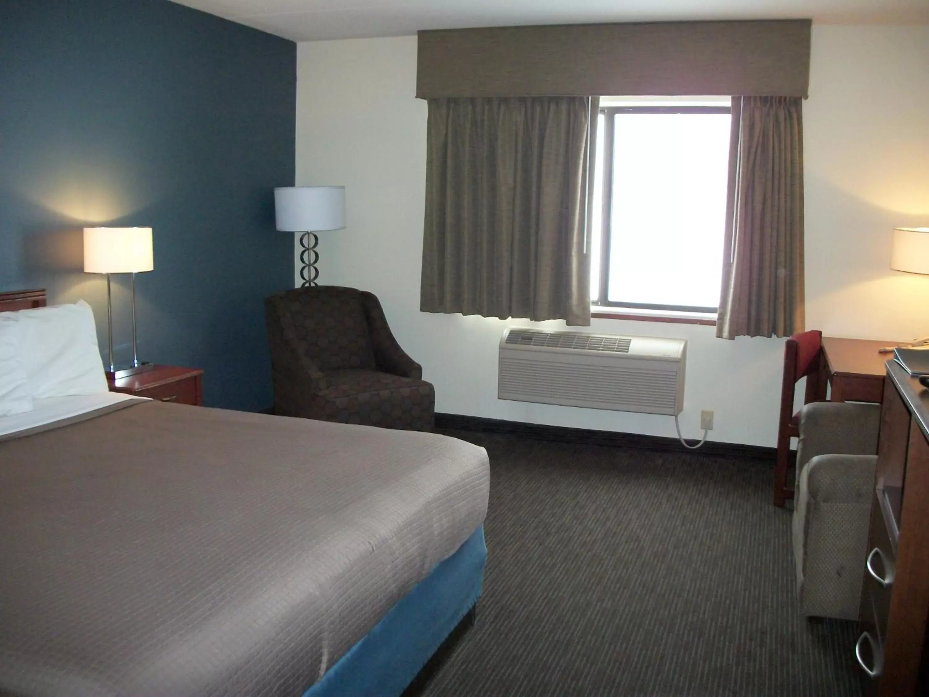 Bed in AmericInn by Wyndham Beulah