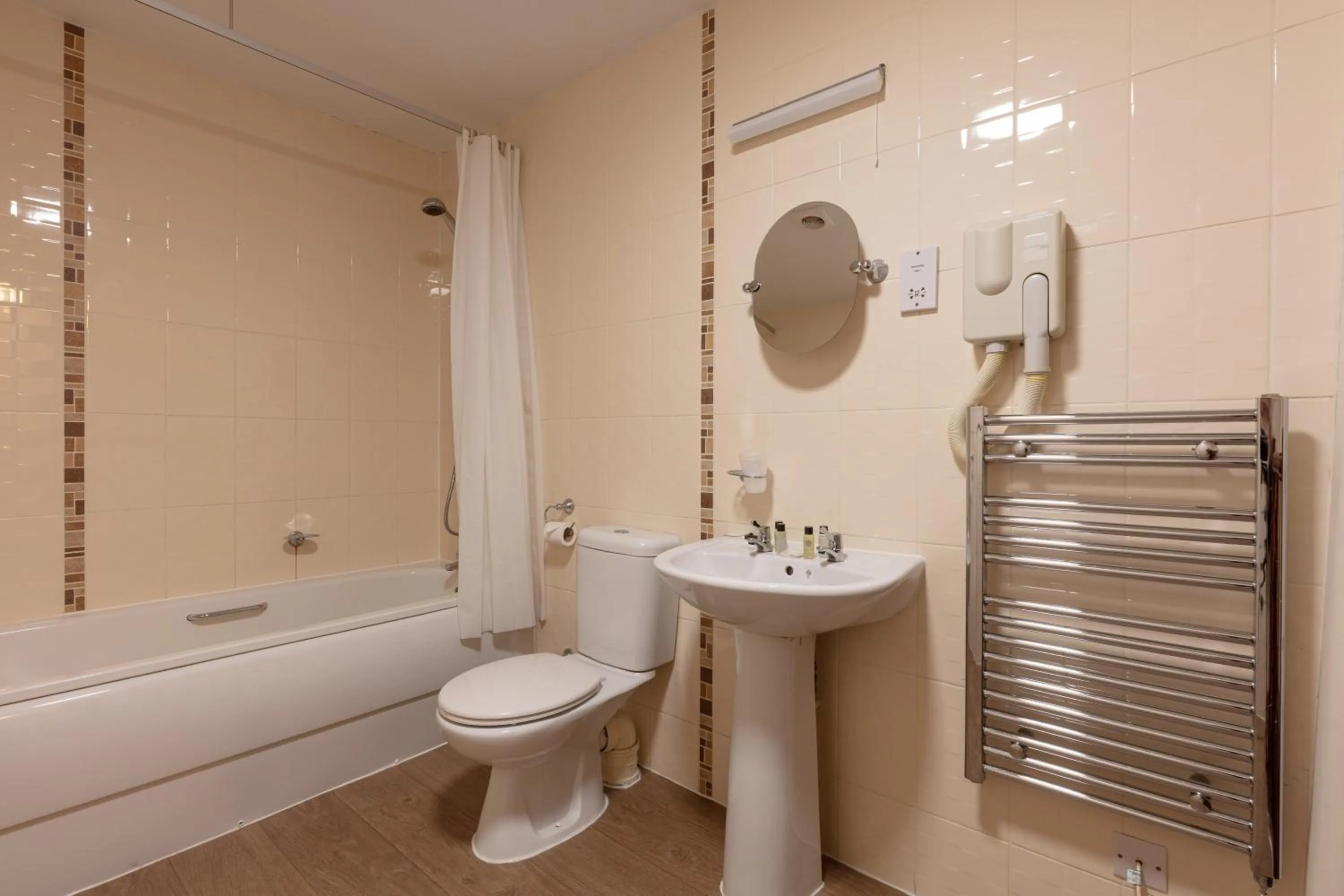 Bathroom in The New Inn by Roomsbooked