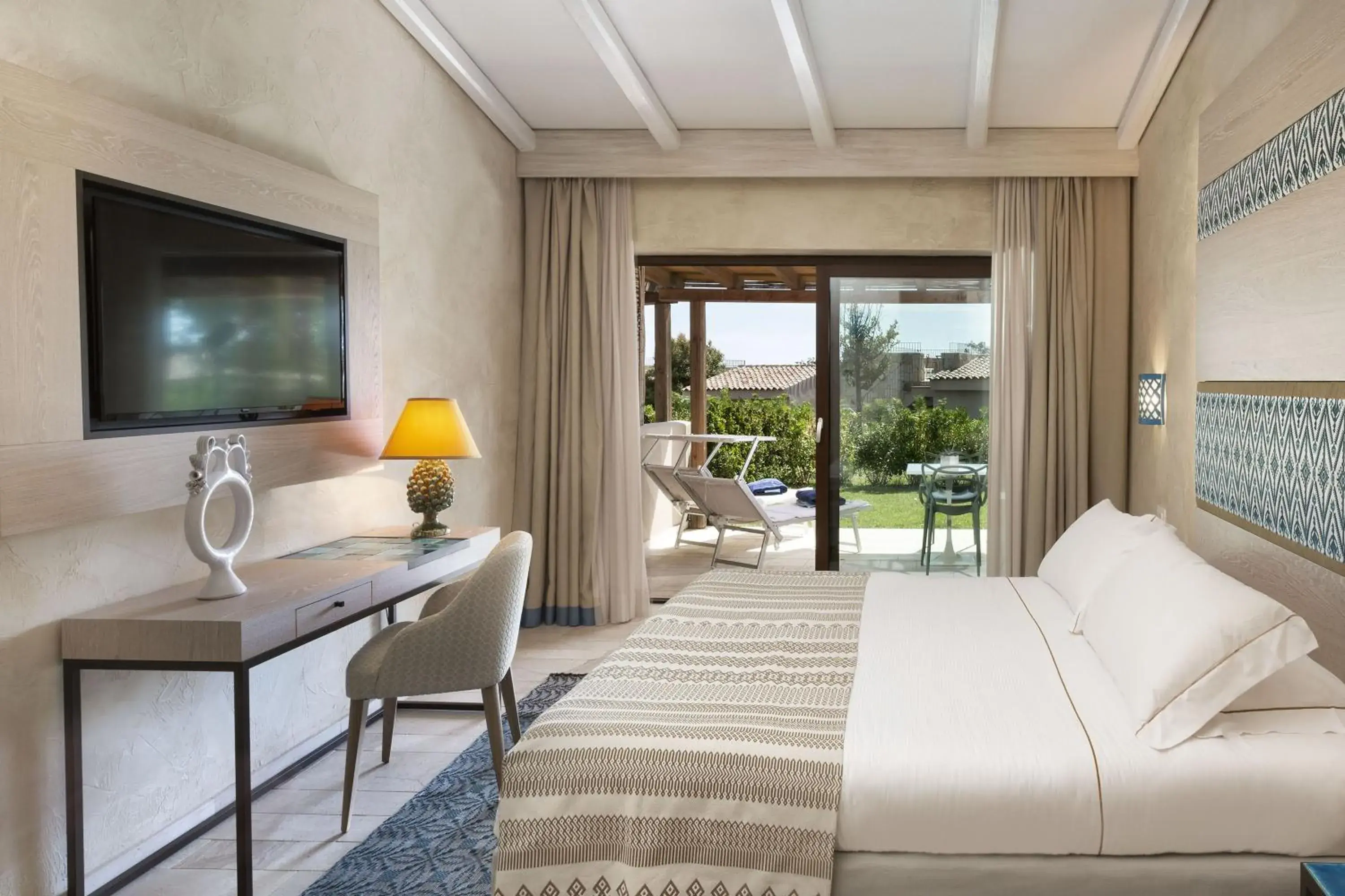 Bedroom, Bed in Baglioni Resort Sardinia - The Leading Hotels of the World Bedroom, Bed in Baglioni Resort Sardinia - The Leading Hotels of the World