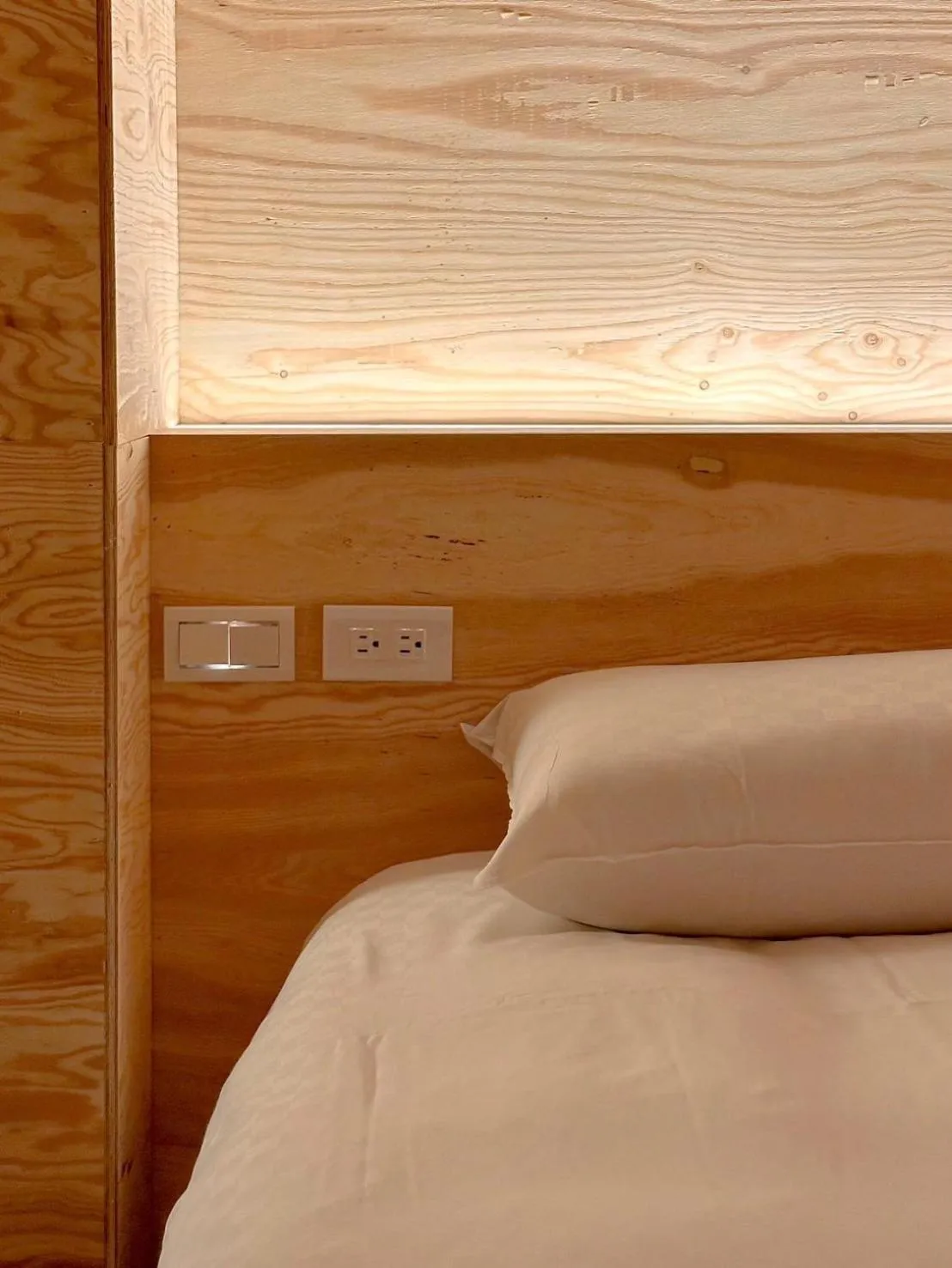 Bed in Mini West Hotel