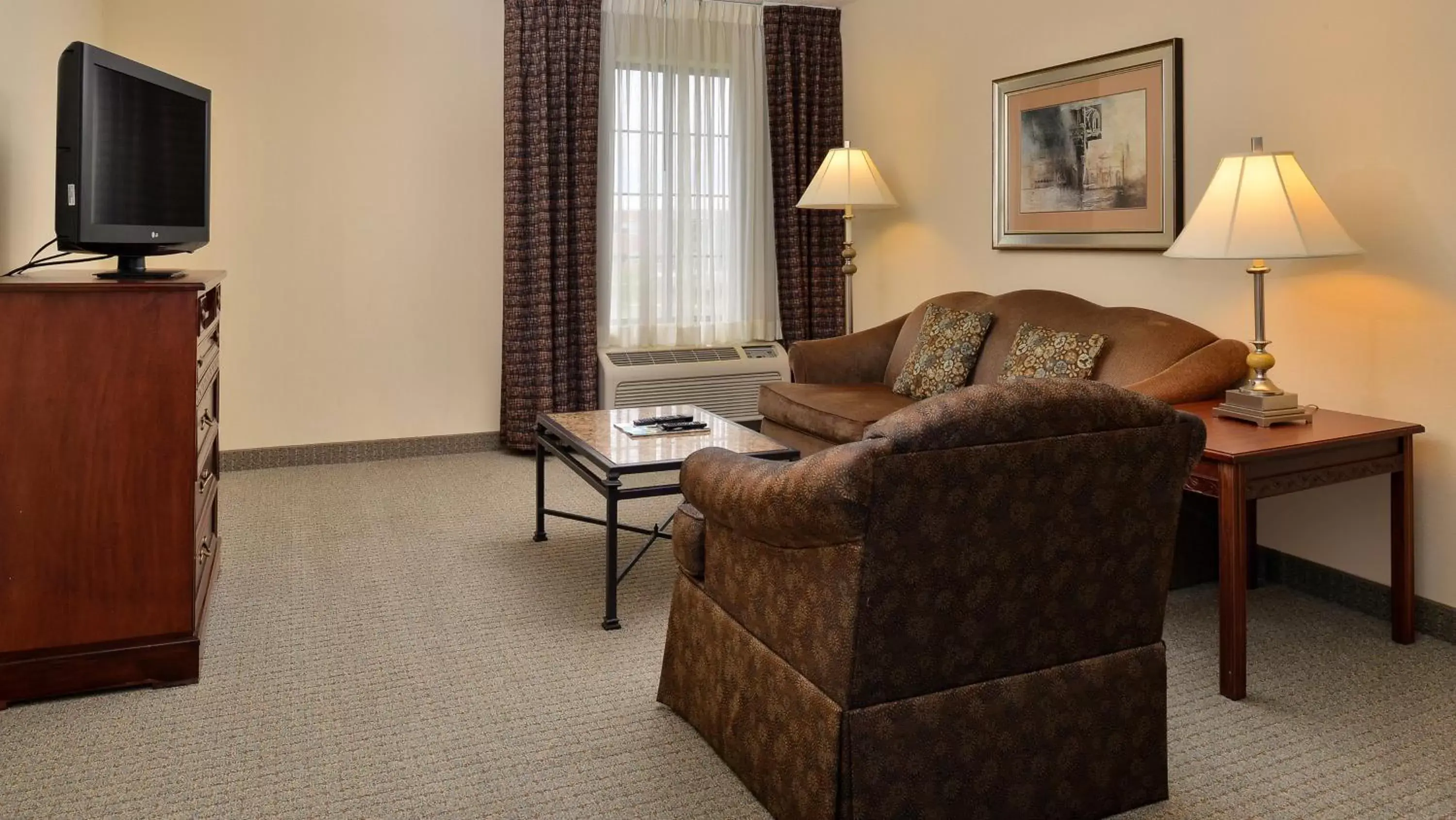 Photo of the whole room, Seating Area in Staybridge Suites West Des Moines, an IHG Hotel