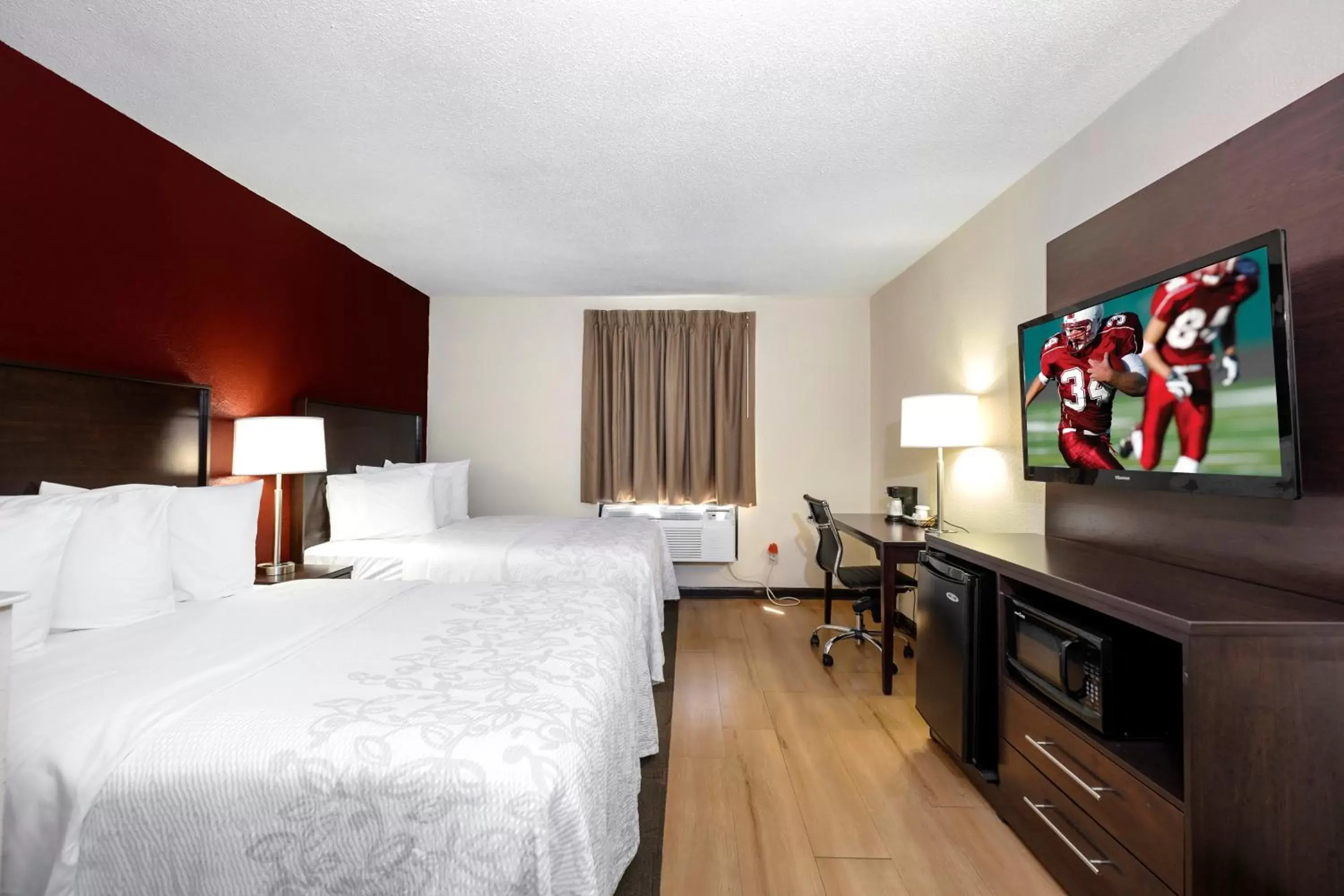 Photo of the whole room, TV/Entertainment Center in Red Roof Inn PLUS+ & Suites Opelika