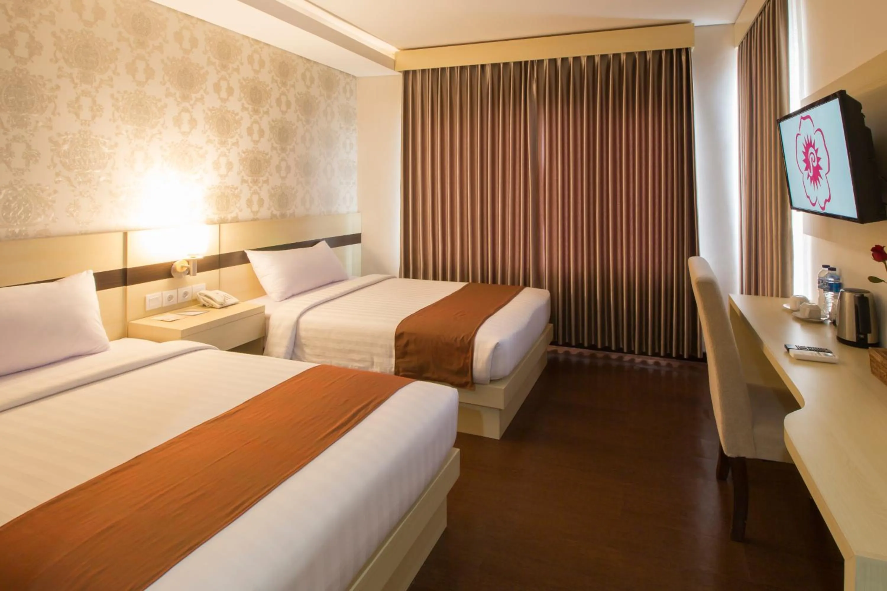 Bed in Grand Puri Saron Hotel Yogyakarta