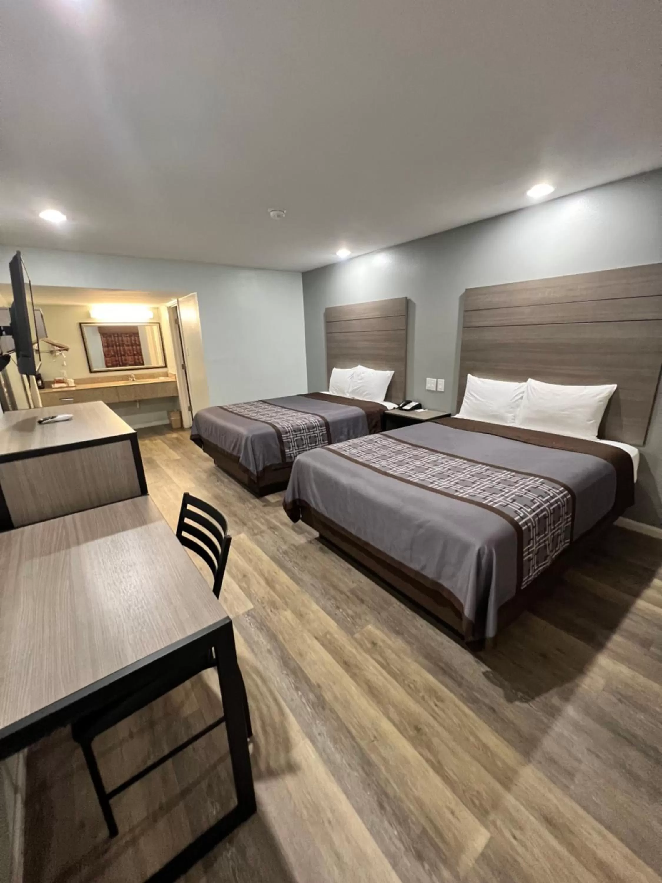 Bed in Continental Inn and Suites Nacogdoches TX SFA University Downtown