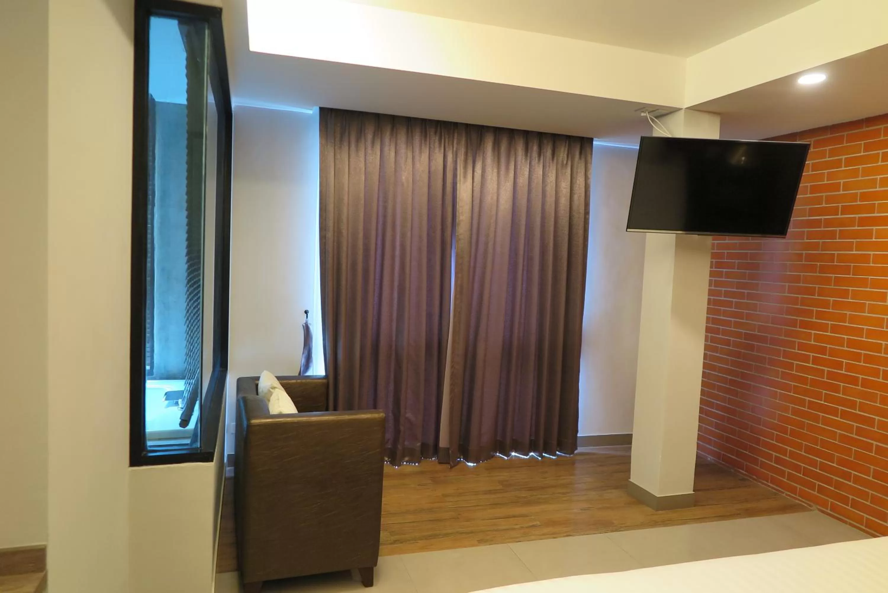 Bedroom in V20 Boutique Jacuzzi Hotel