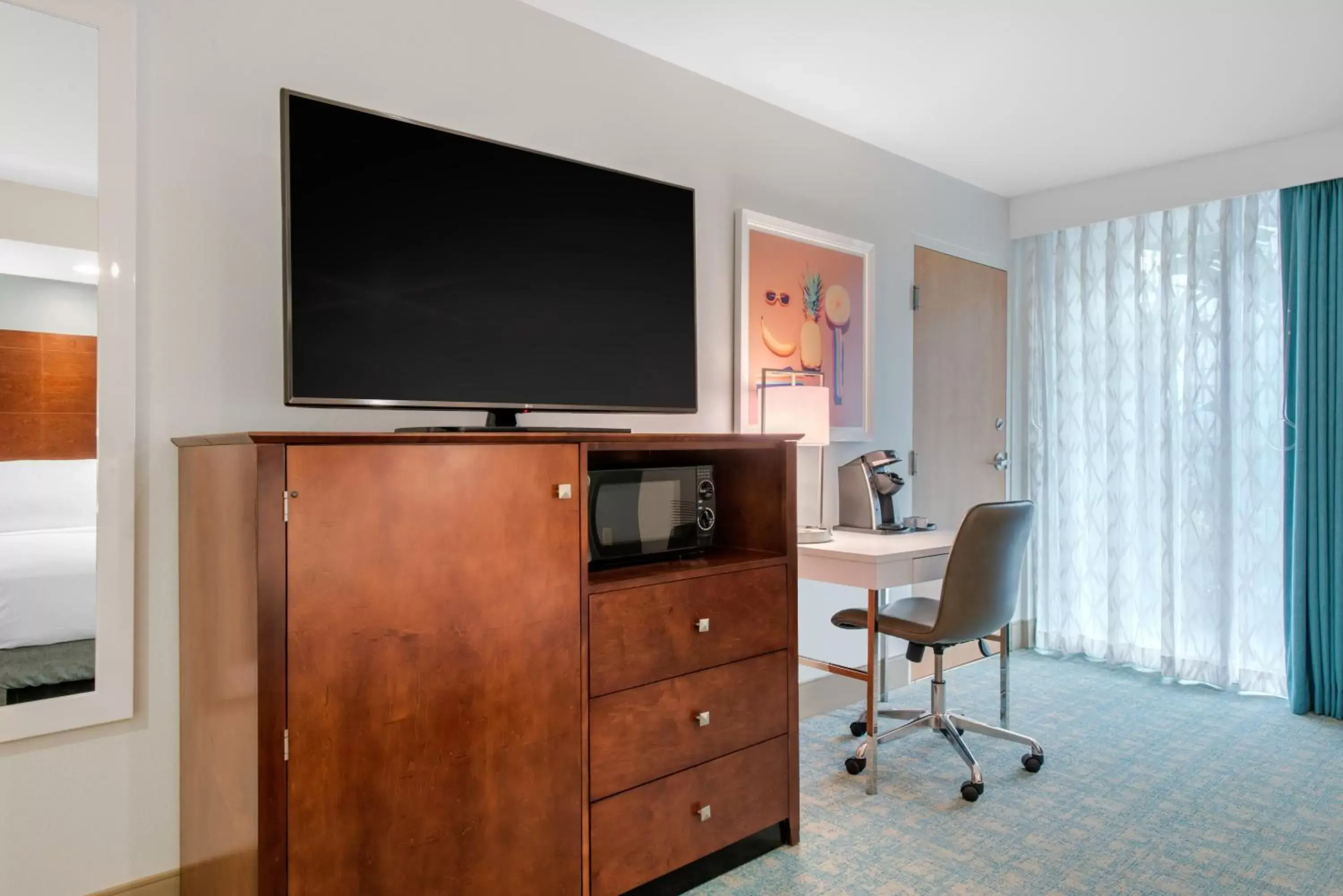 TV and multimedia, TV/Entertainment Center in Holiday Inn Orlando – Disney Springs™ Area, an IHG Hotel