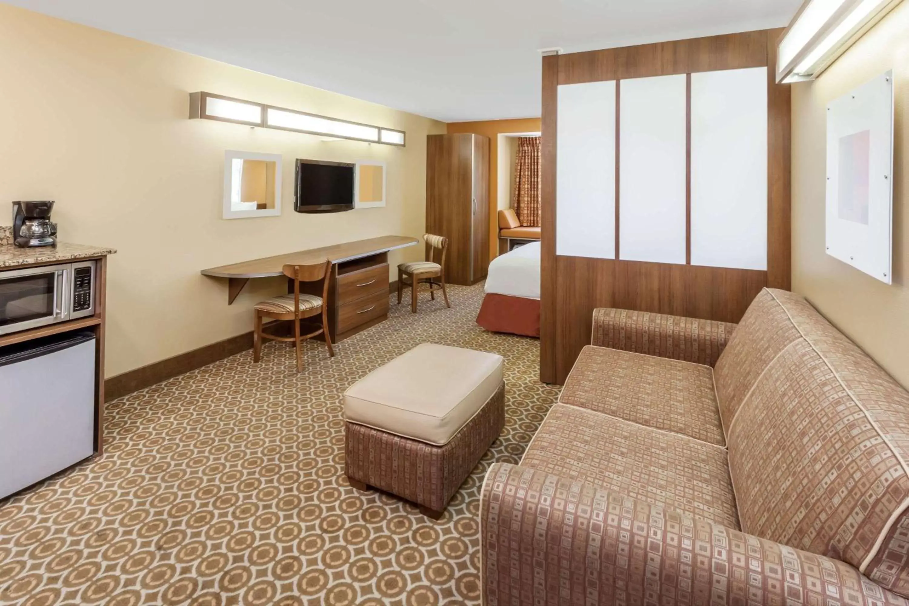 Photo of the whole room, Seating Area in Microtel by Wyndham South Bend Notre Dame University