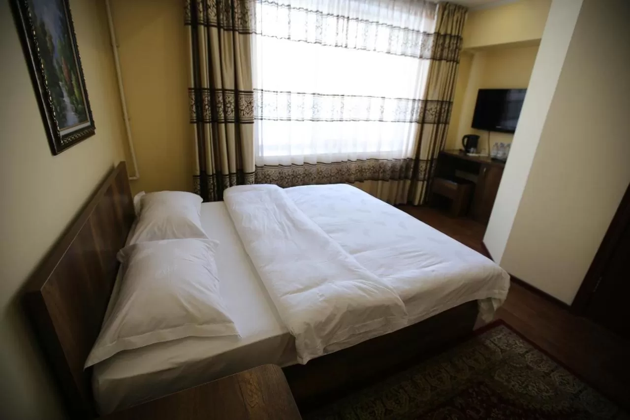 Bed in Altai Business Hotel