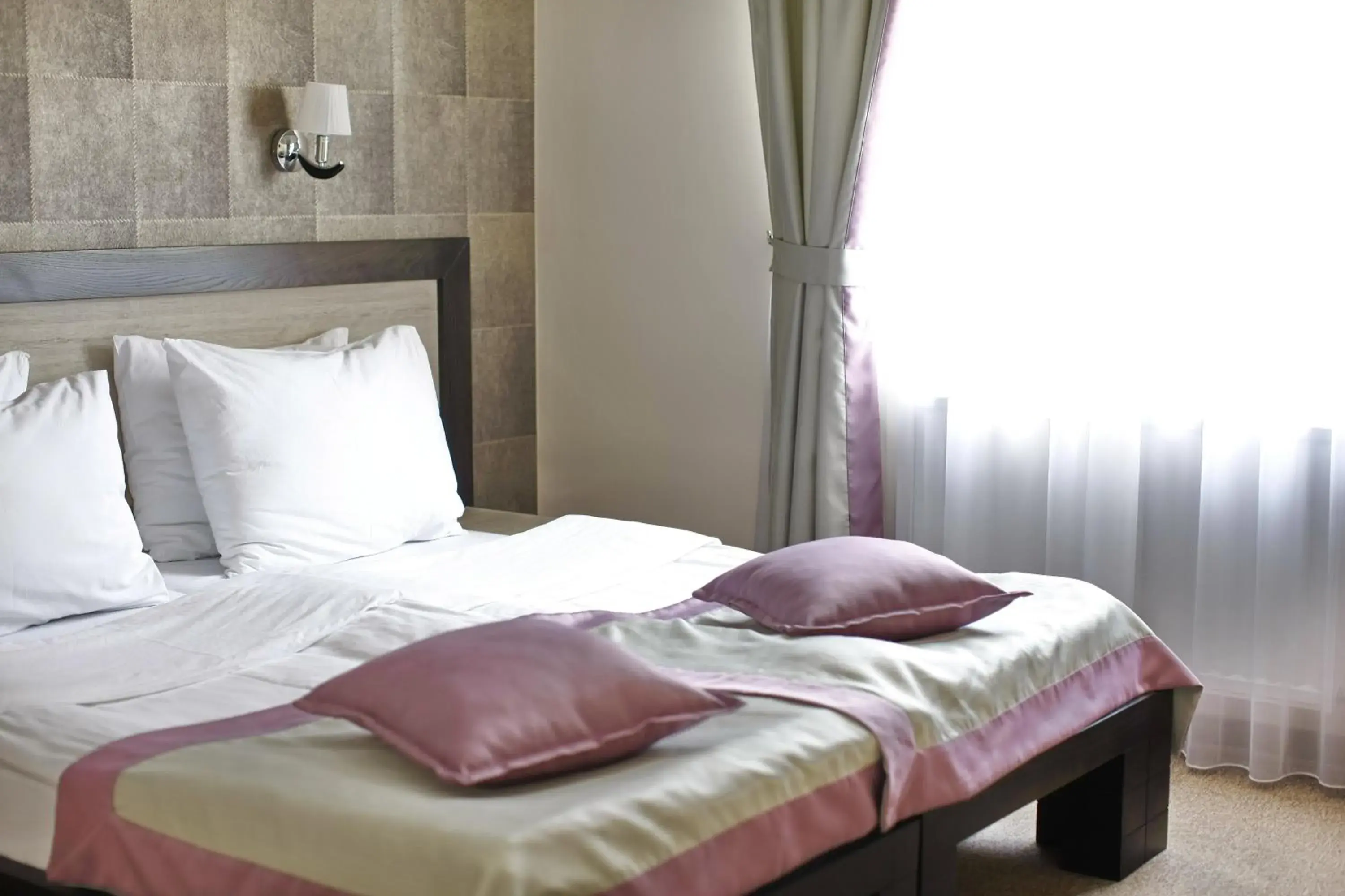 Bed in Garni Hotel Vozarev