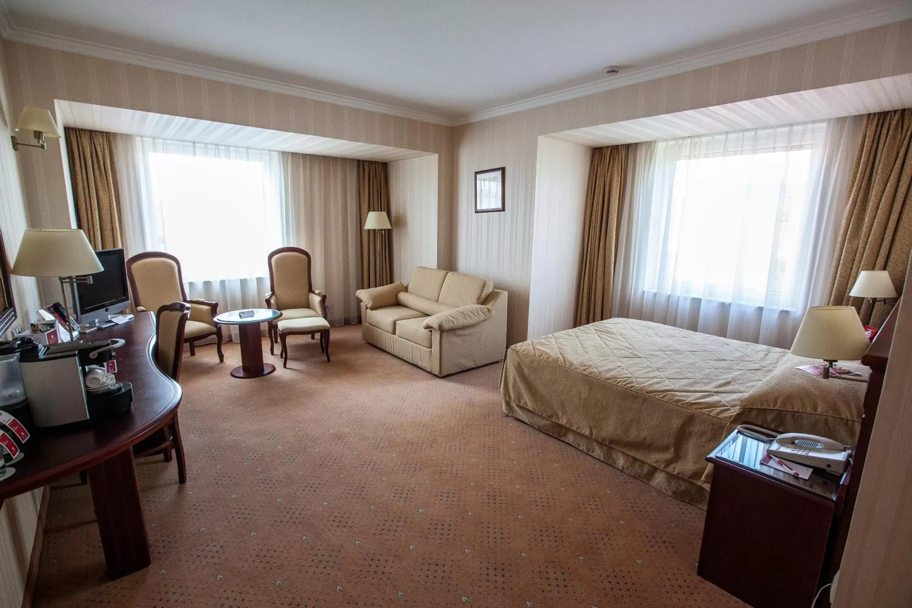 Bed in Ramada Hotel & Suites by Wyndham Bucharest North