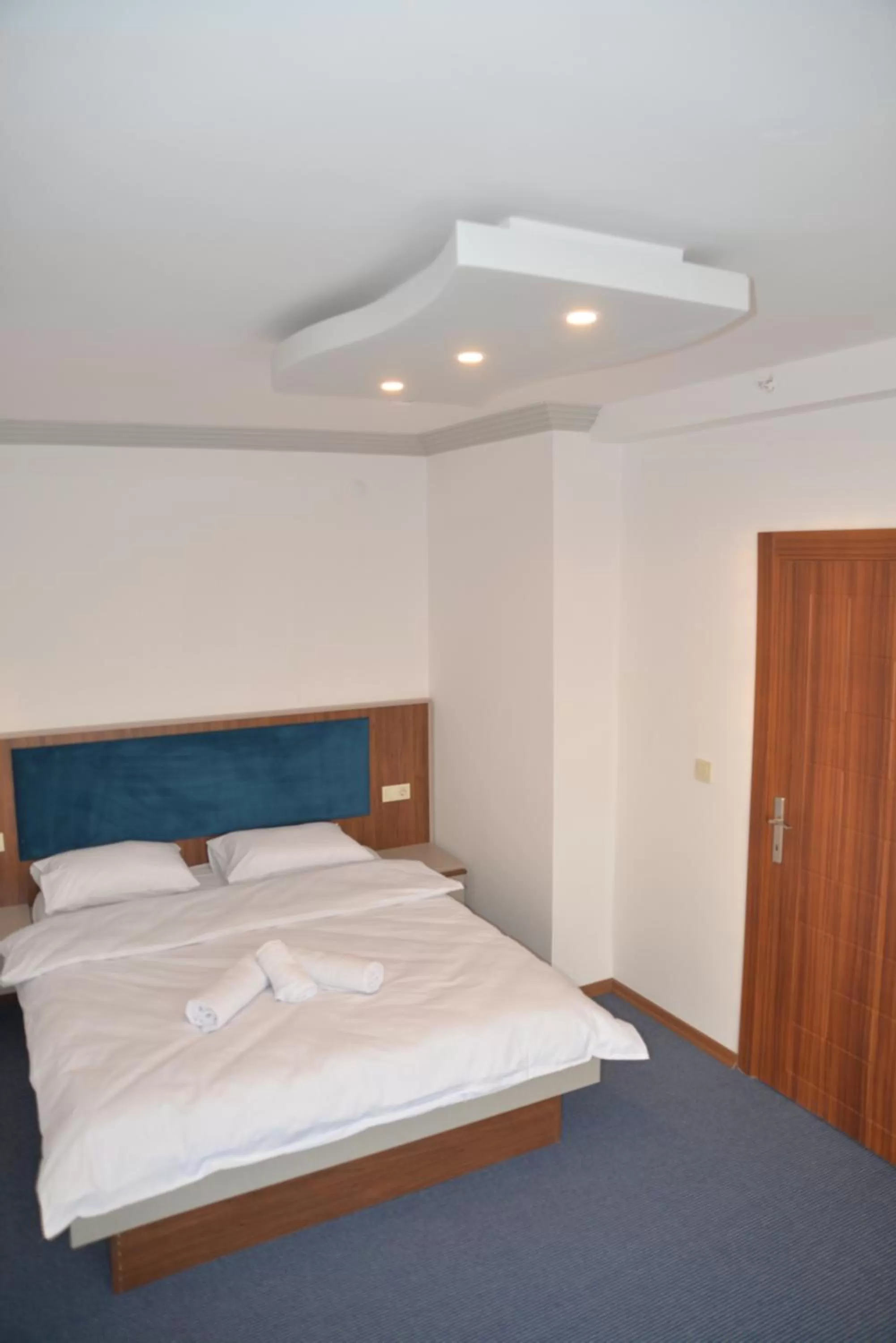 Bed in TEVETOGLU HOTEL