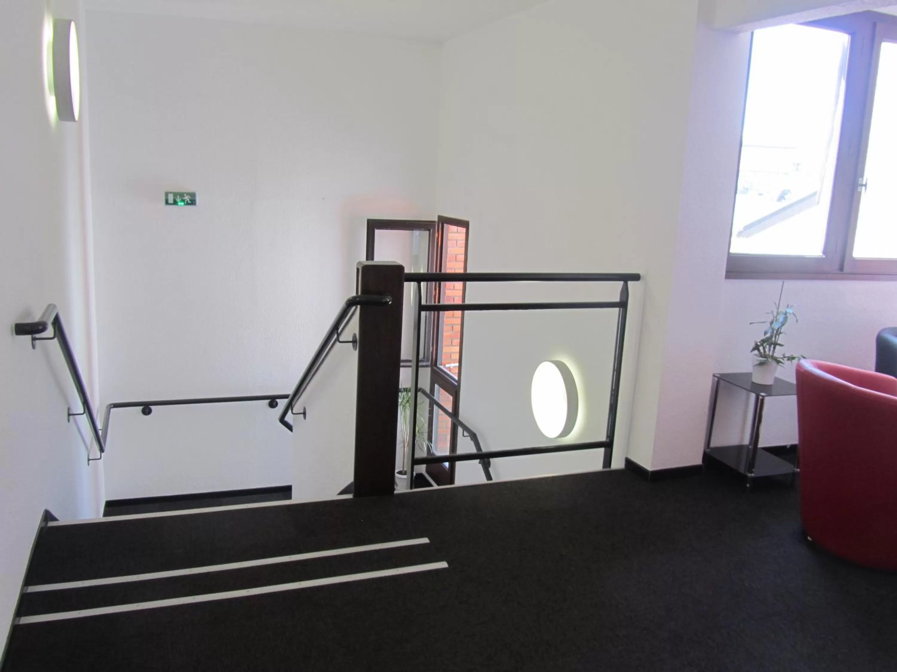 Communal lounge/ TV room in Hôtel - Restaurant Le Saint Joseph