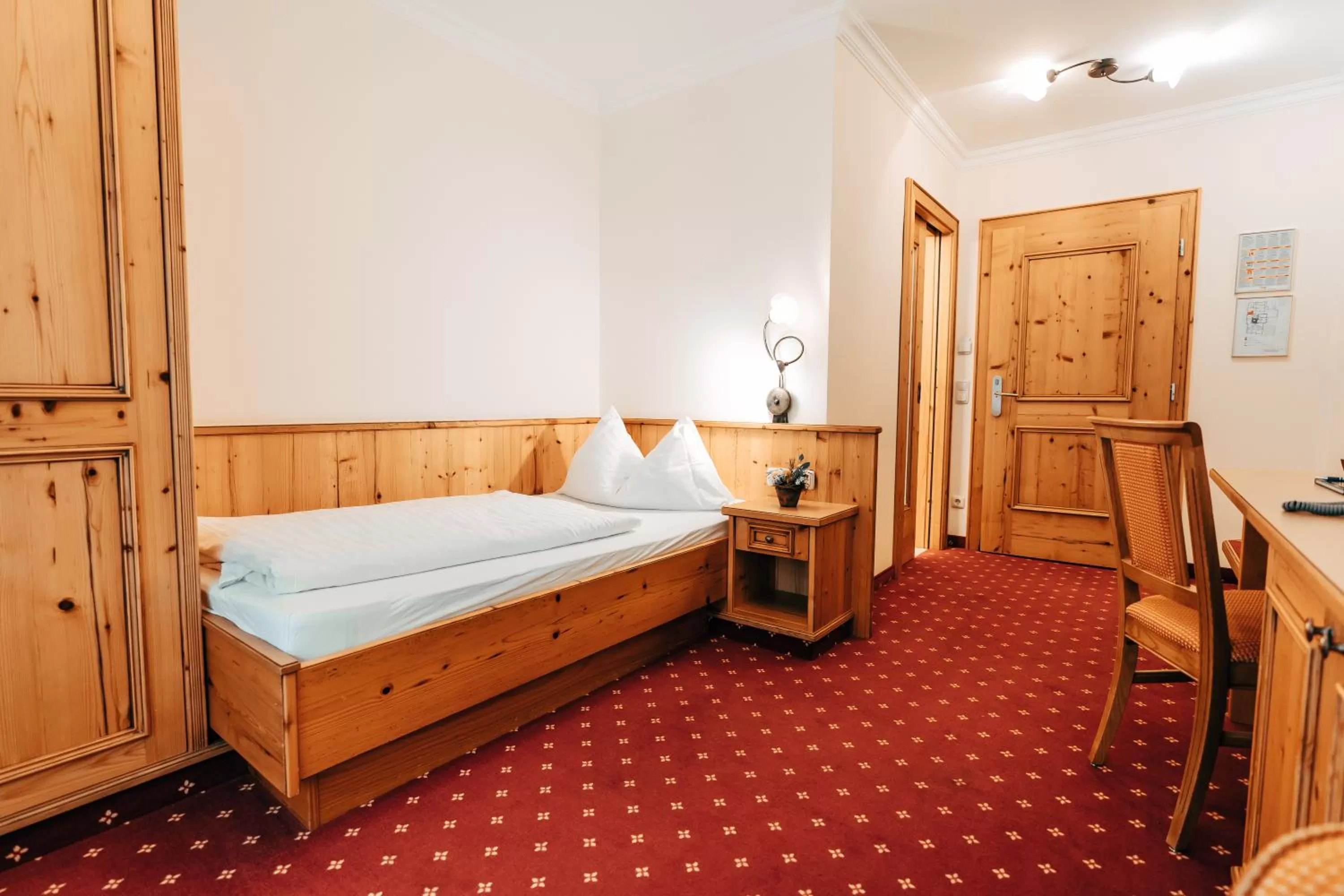 Bed in POST POST Hotel - Alpine Boutique Hotel & Spa