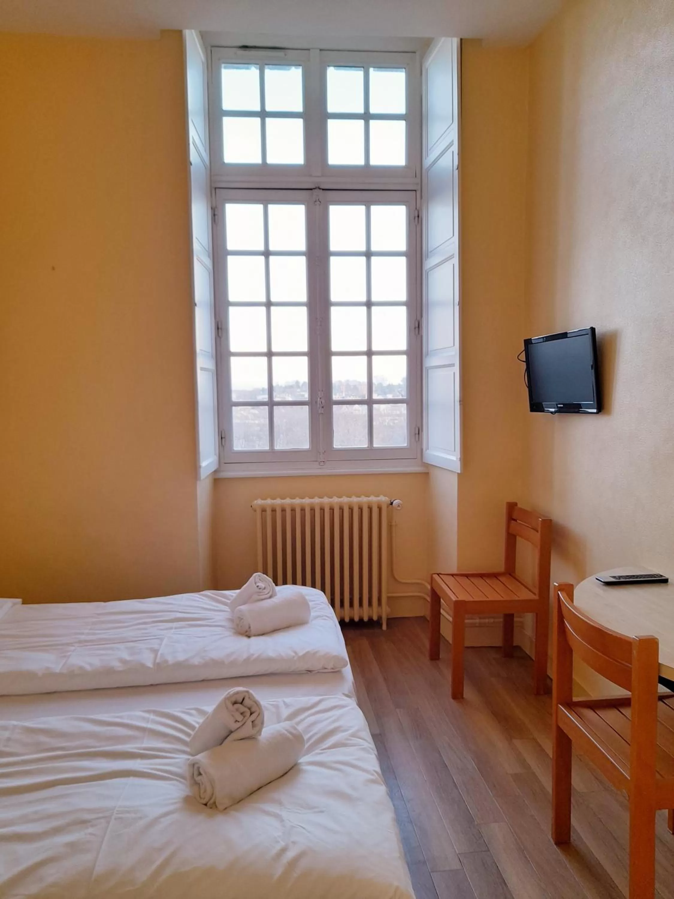 Bed in Hôtellerie Saint Yves