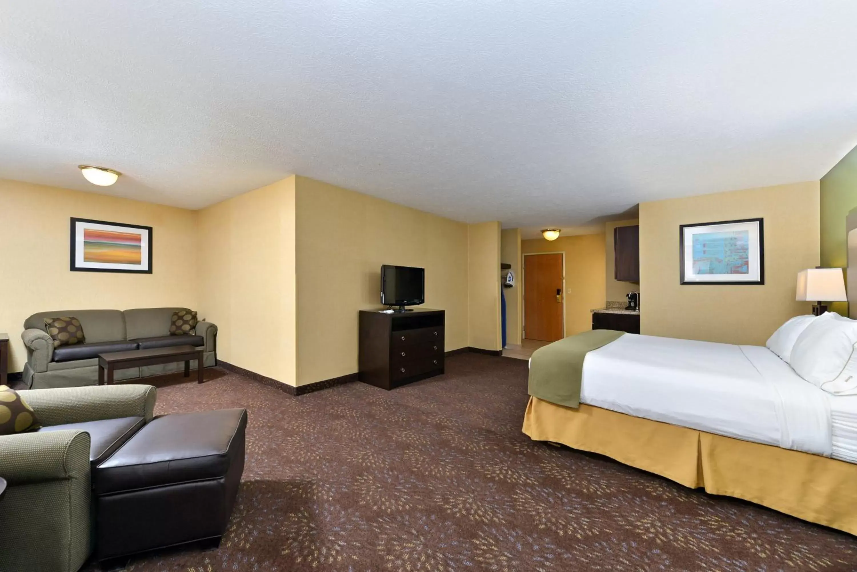 Photo of the whole room, TV/Entertainment Center in Holiday Inn Express Hotel & Suites Charlotte, an IHG Hotel