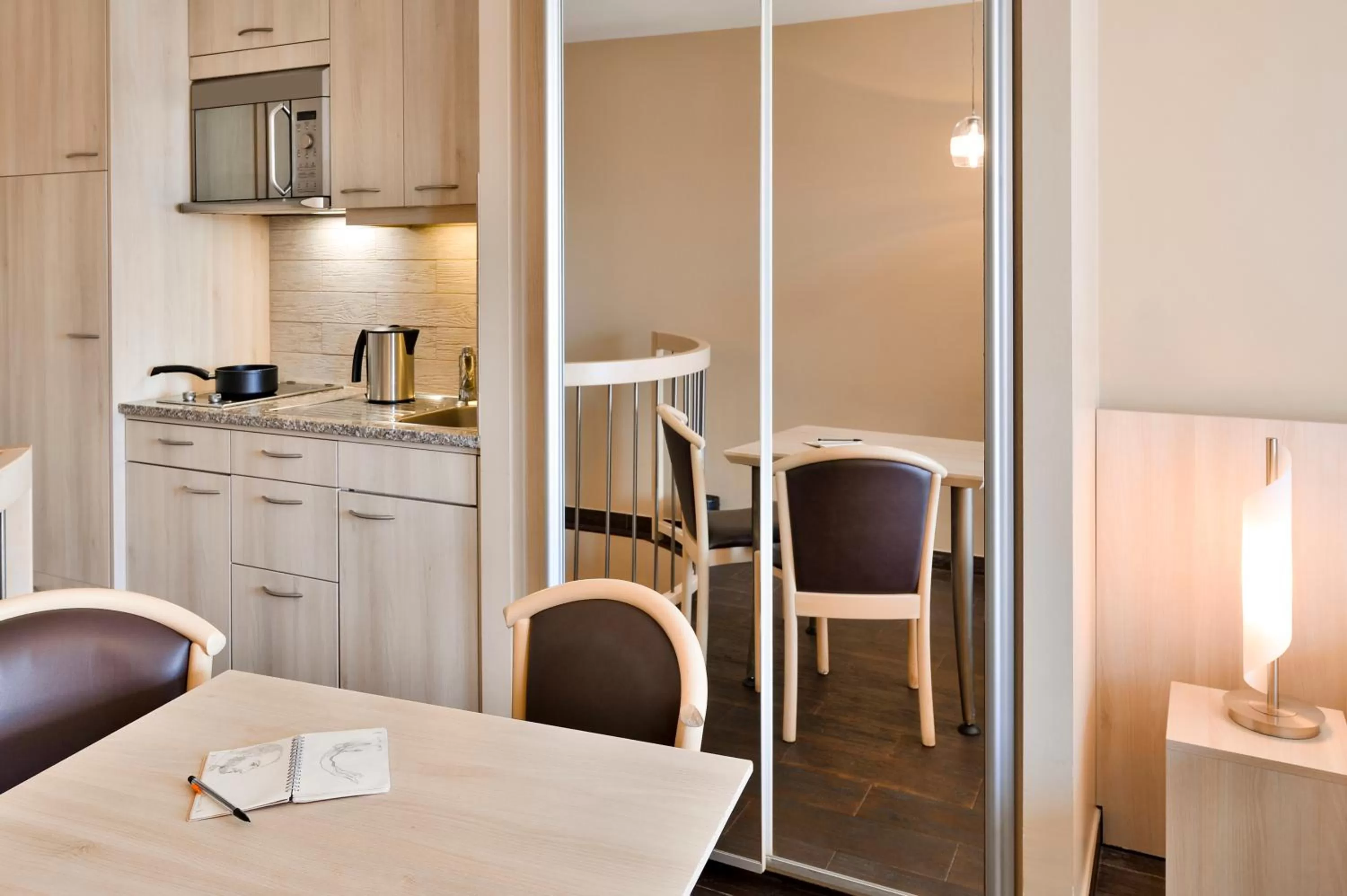 Kitchen or kitchenette in Aparthotel Adagio Genève Mont-Blanc