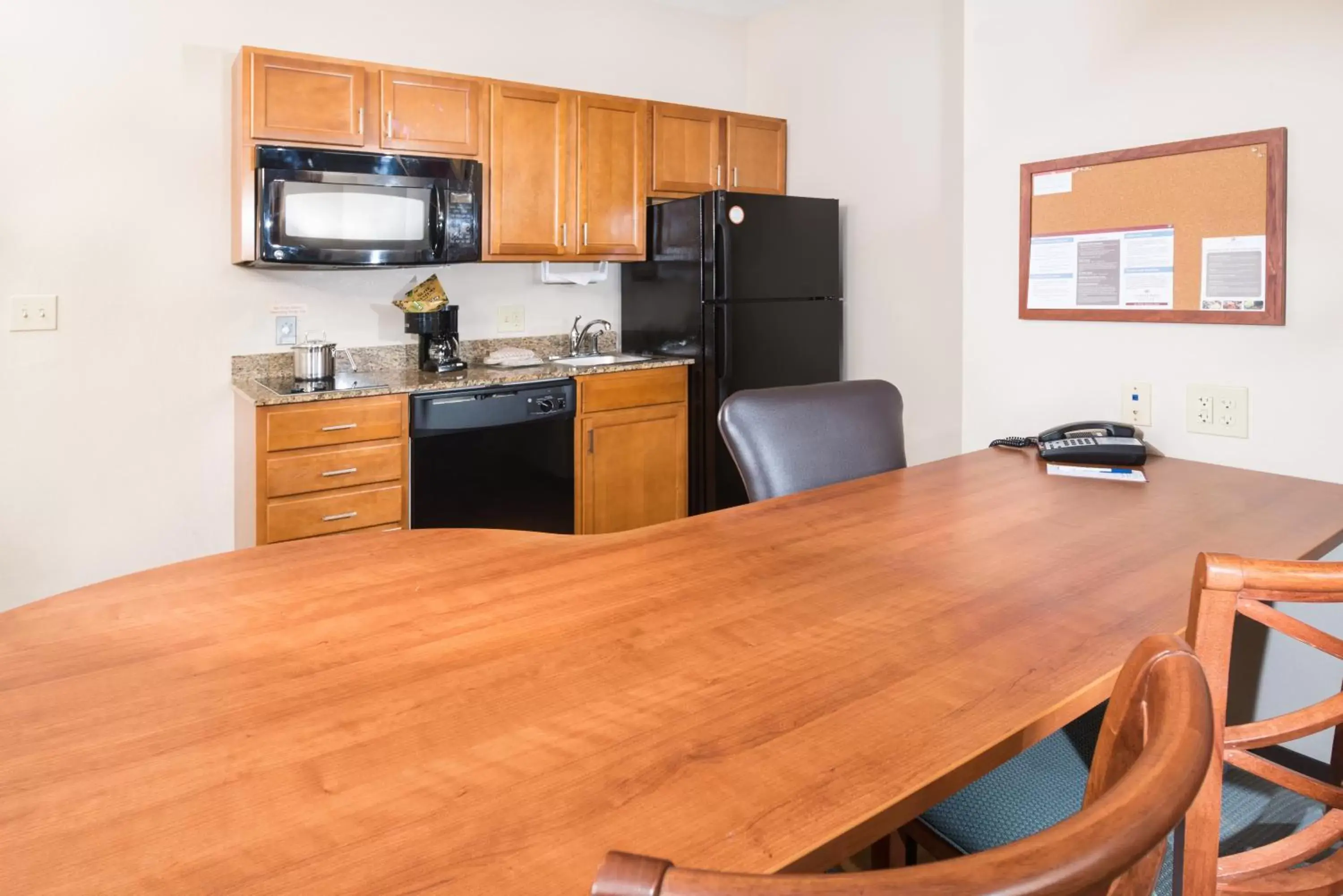 Photo of the whole room, Kitchen/Kitchenette in Candlewood Suites Wake Forest-Raleigh Area, an IHG Hotel