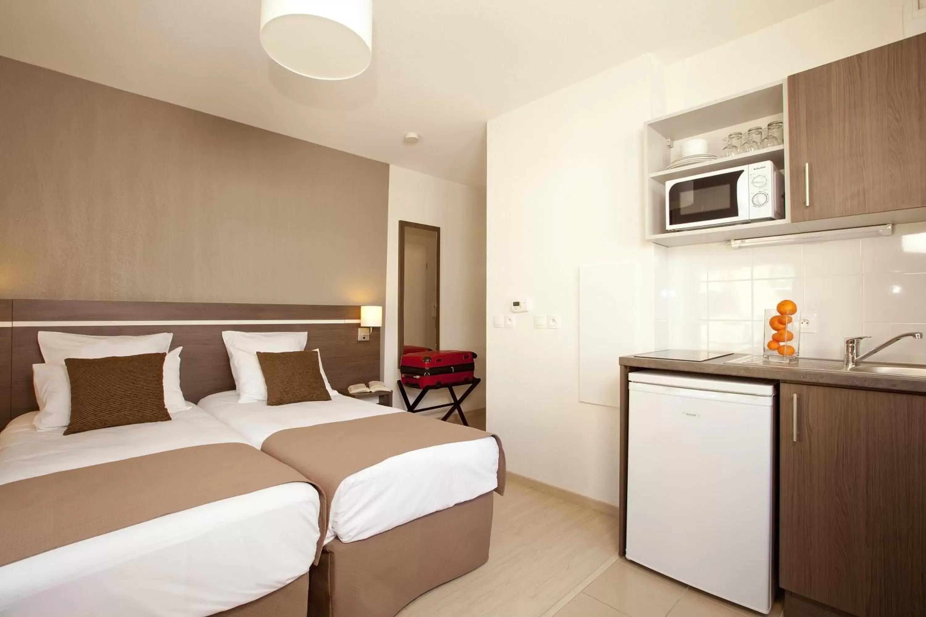 Decorative detail, Bed in Séjours & Affaires Massy Atlantis Decorative detail, Bed in Séjours & Affaires Massy Atlantis