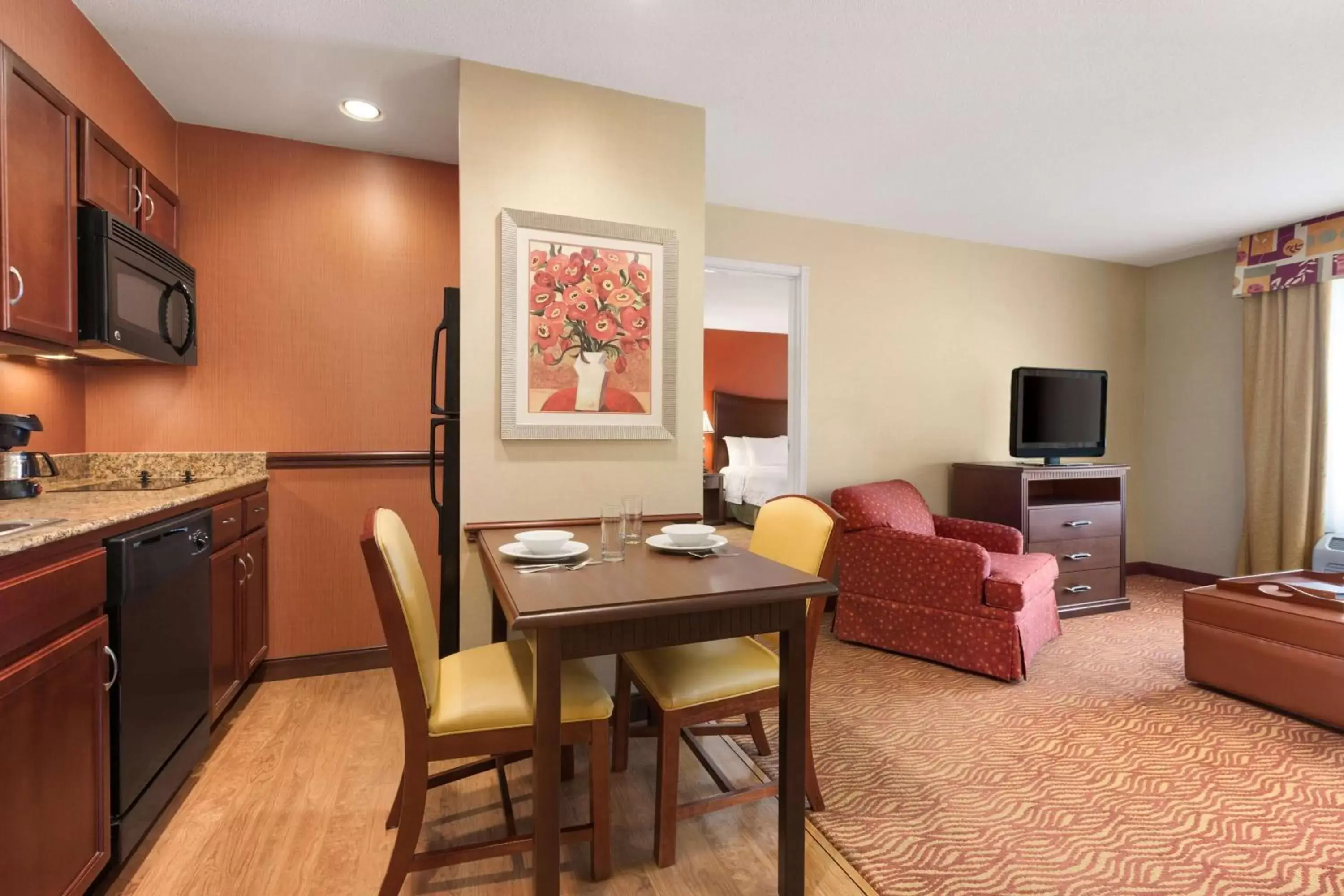 Bed, Dining Area in Homewood Suites Medford