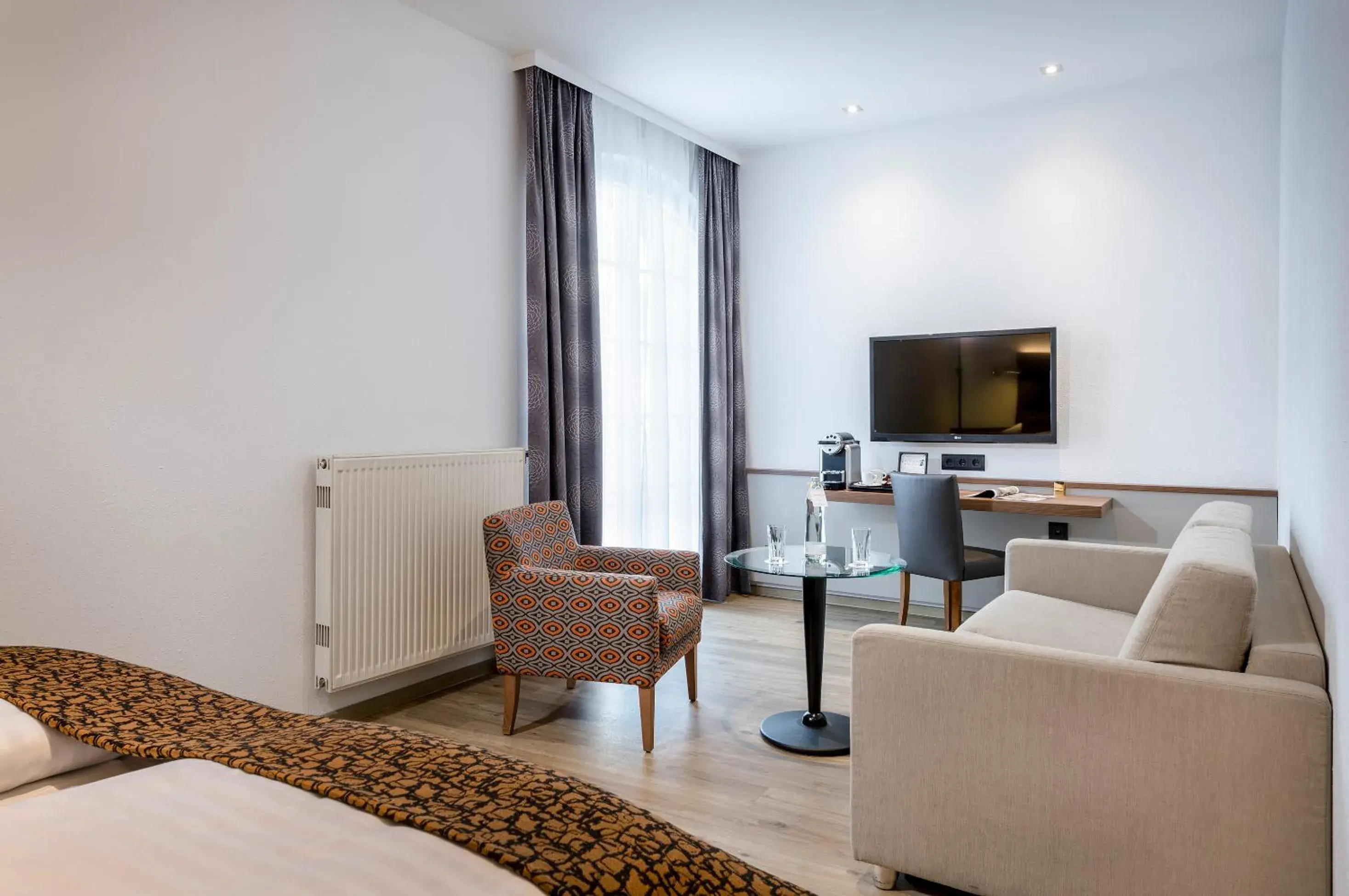 Seating area, TV/Entertainment Center in Hotel Nestroy Wien