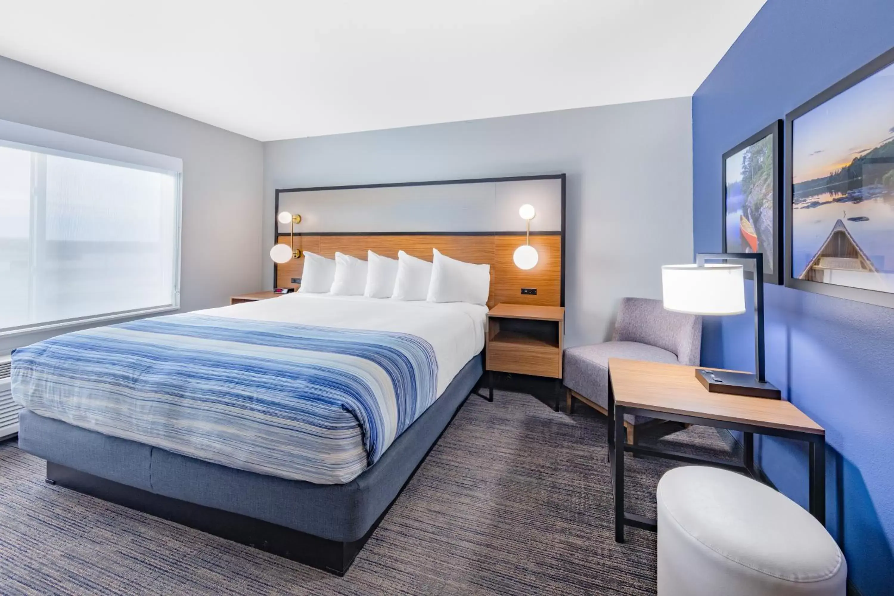 Bed in AmericInn by Wyndham International Falls