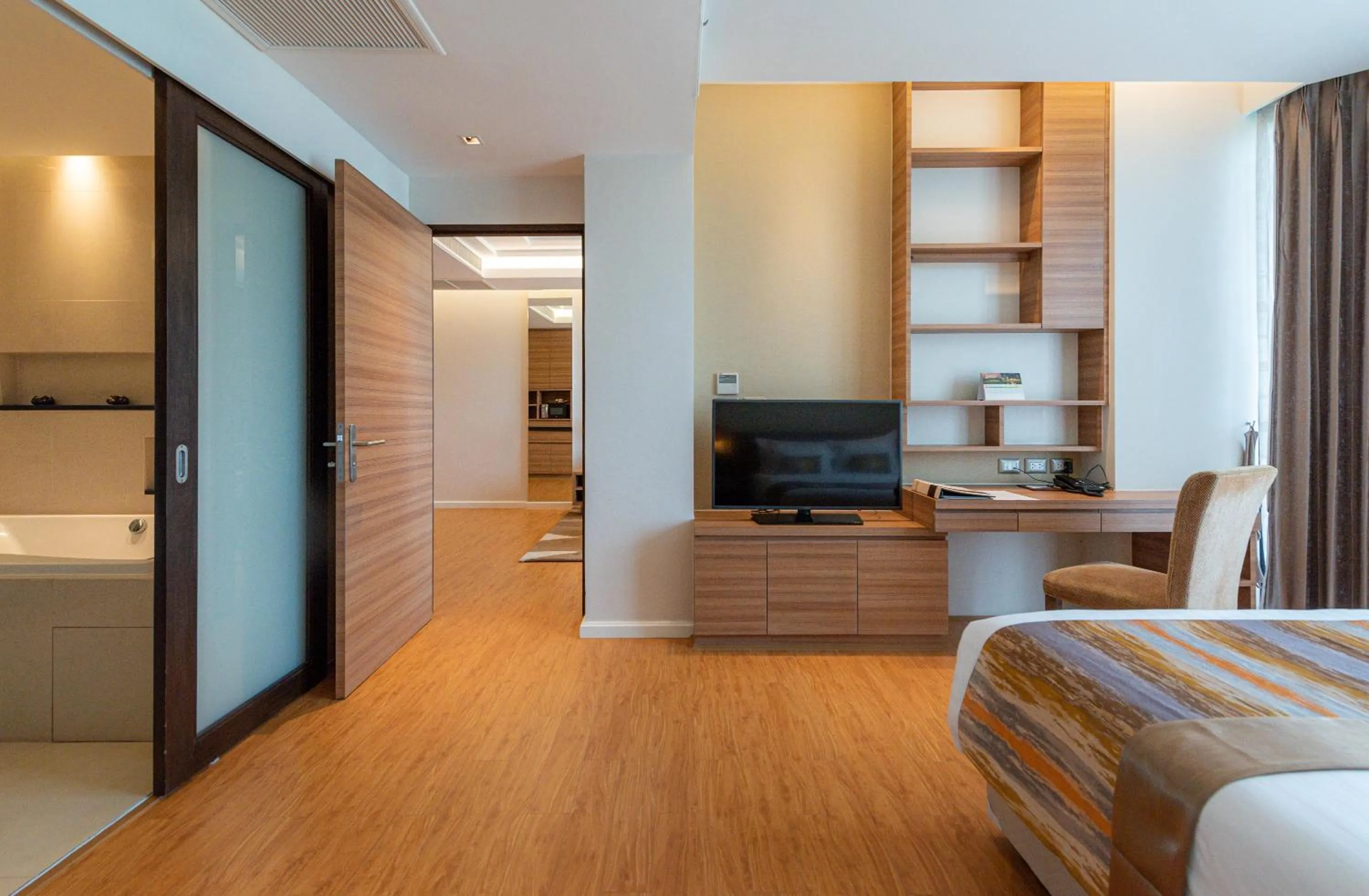 Bedroom in Summit Windmill Golf Suite Hotel at Suvarnabhumi