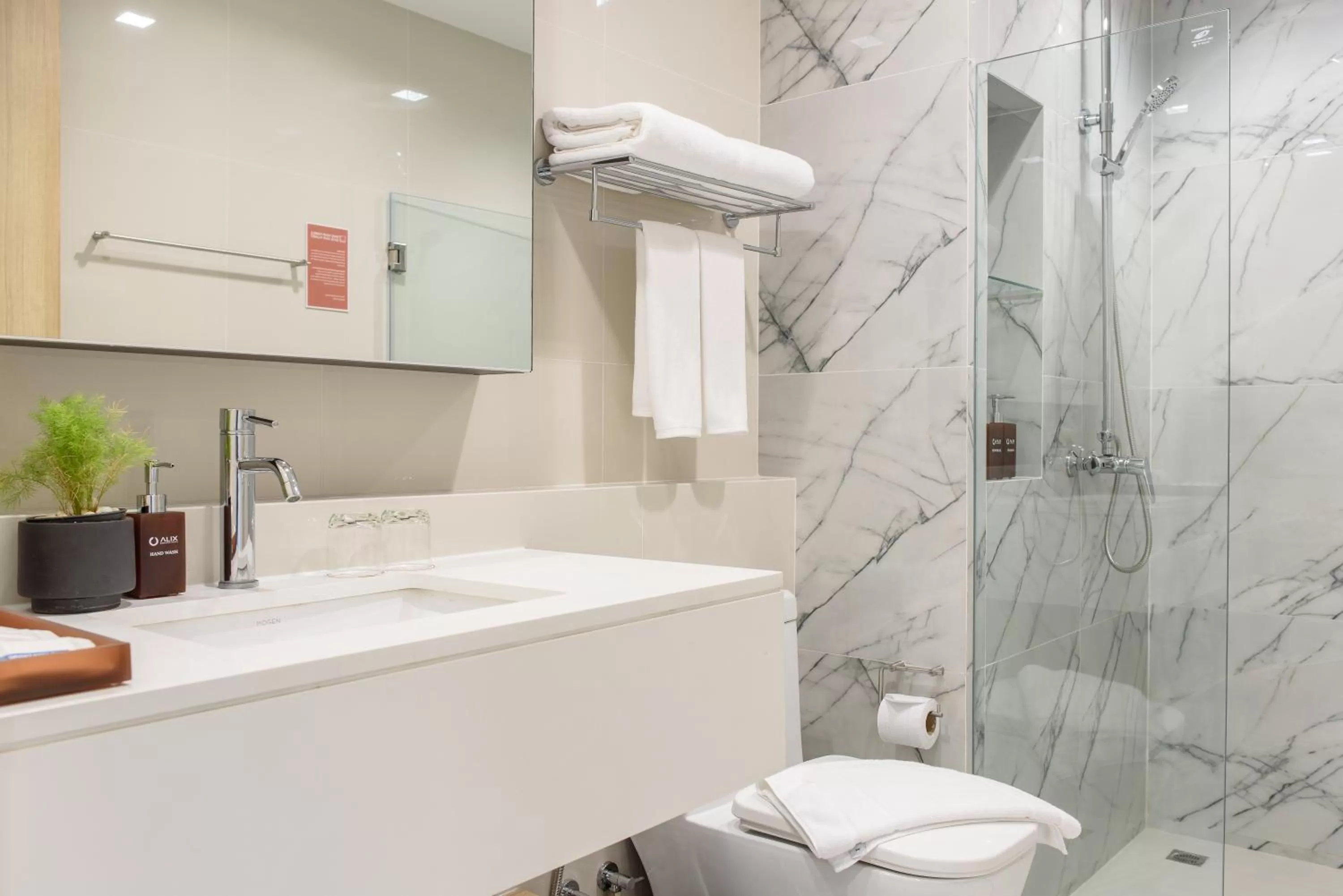 Toilet in Alix Bangkok Hotel