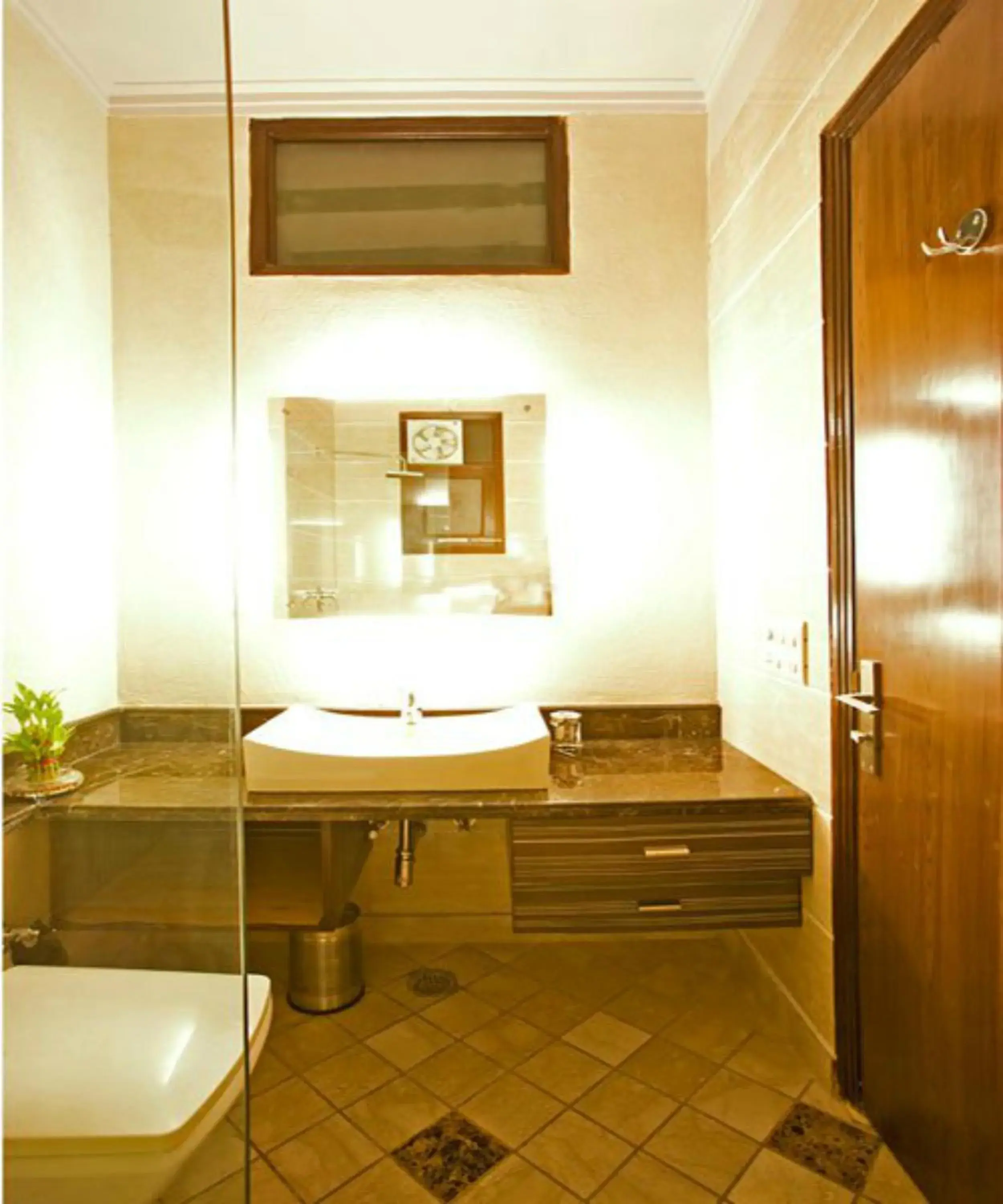 Bathroom in Evergreen Suites Defence Colony