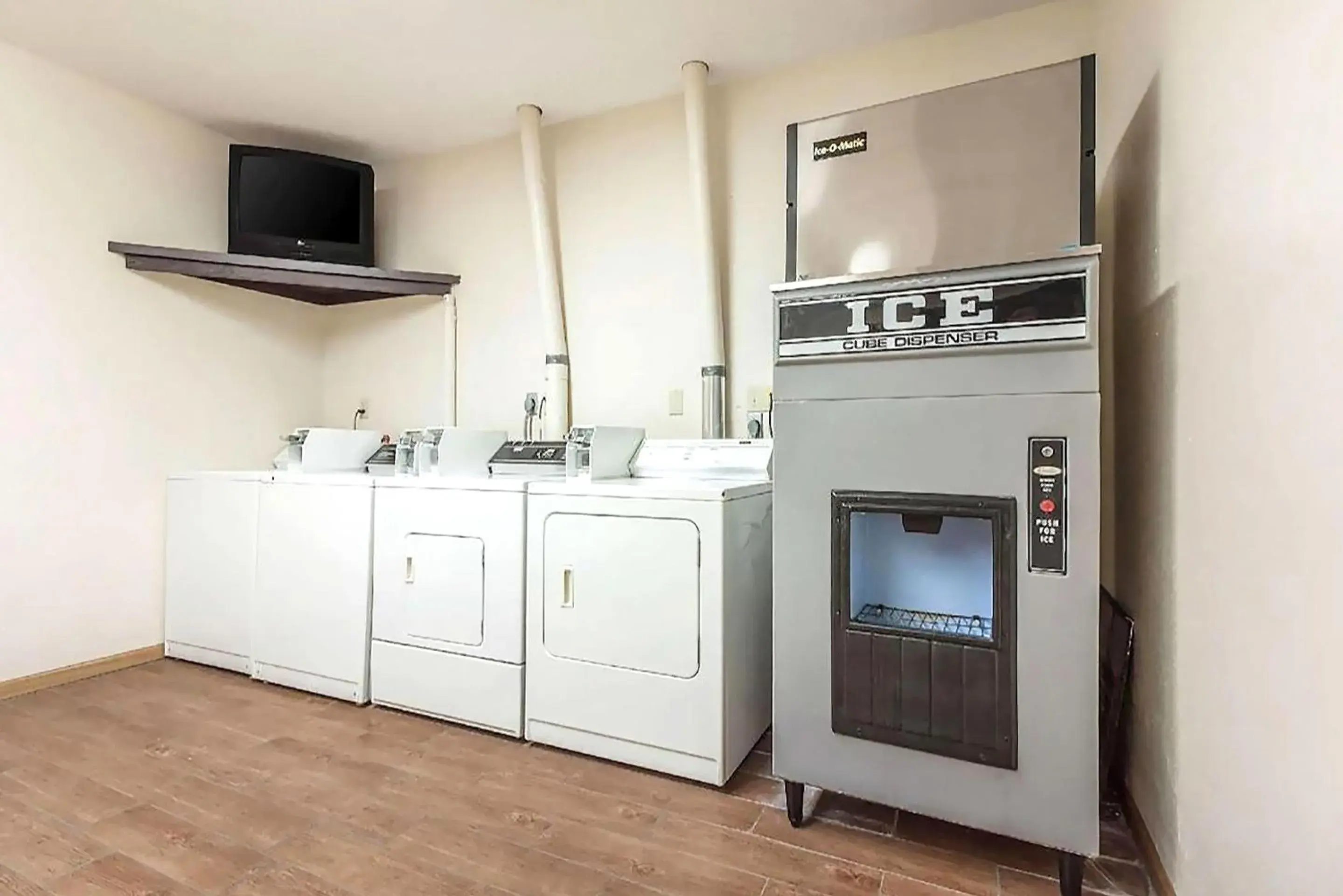 laundry, TV/Entertainment Center in Coratel Inn & Suites by Jasper McCook